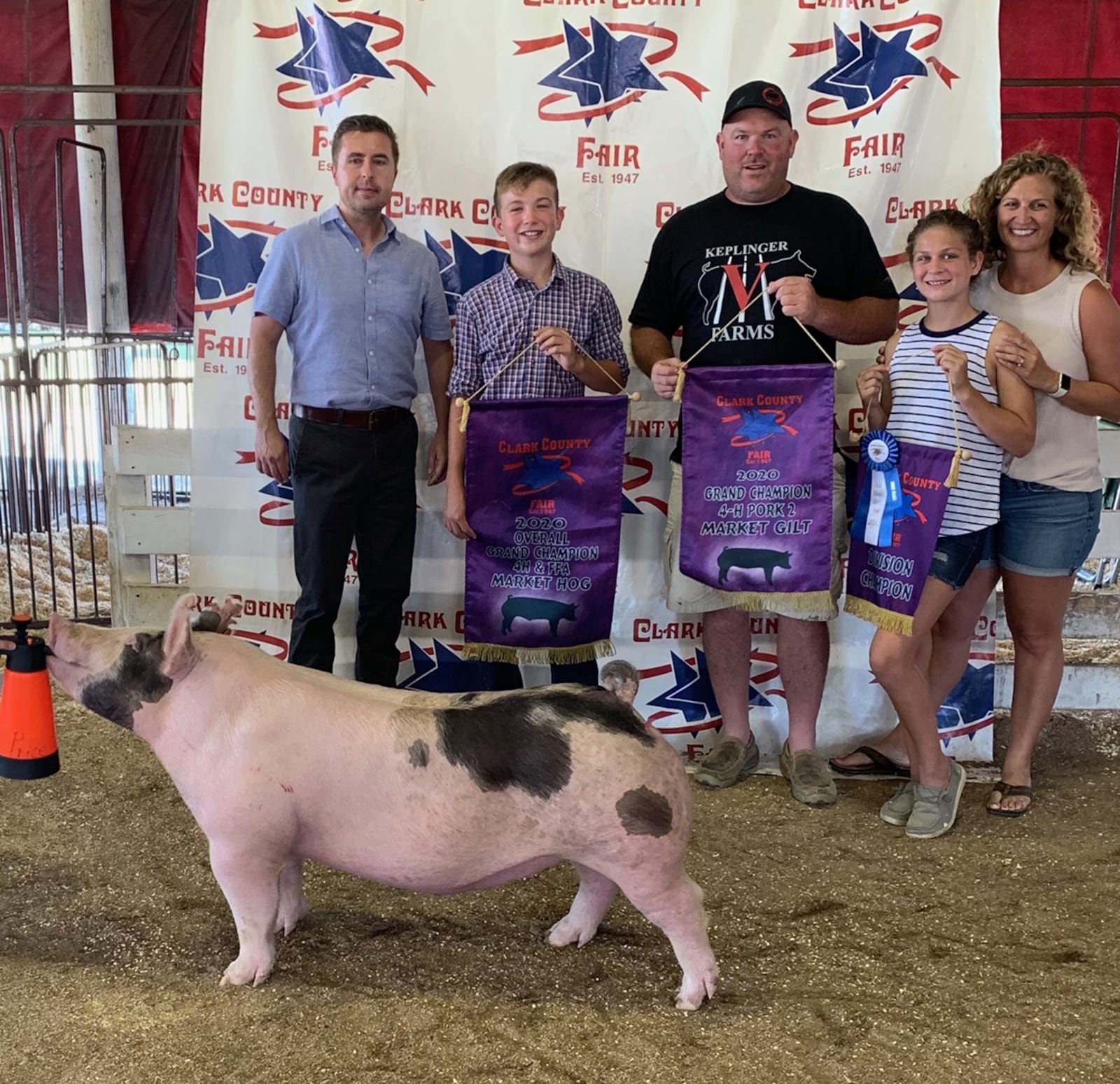 Judge Brian Arnold, CJ Wilt, Chad Wilt, Addie Wilt and Melanie Flax-Wilt pose with the grand champion hog at the 2020 Clark County Fair. (Photo contributed by Chad Wilt)