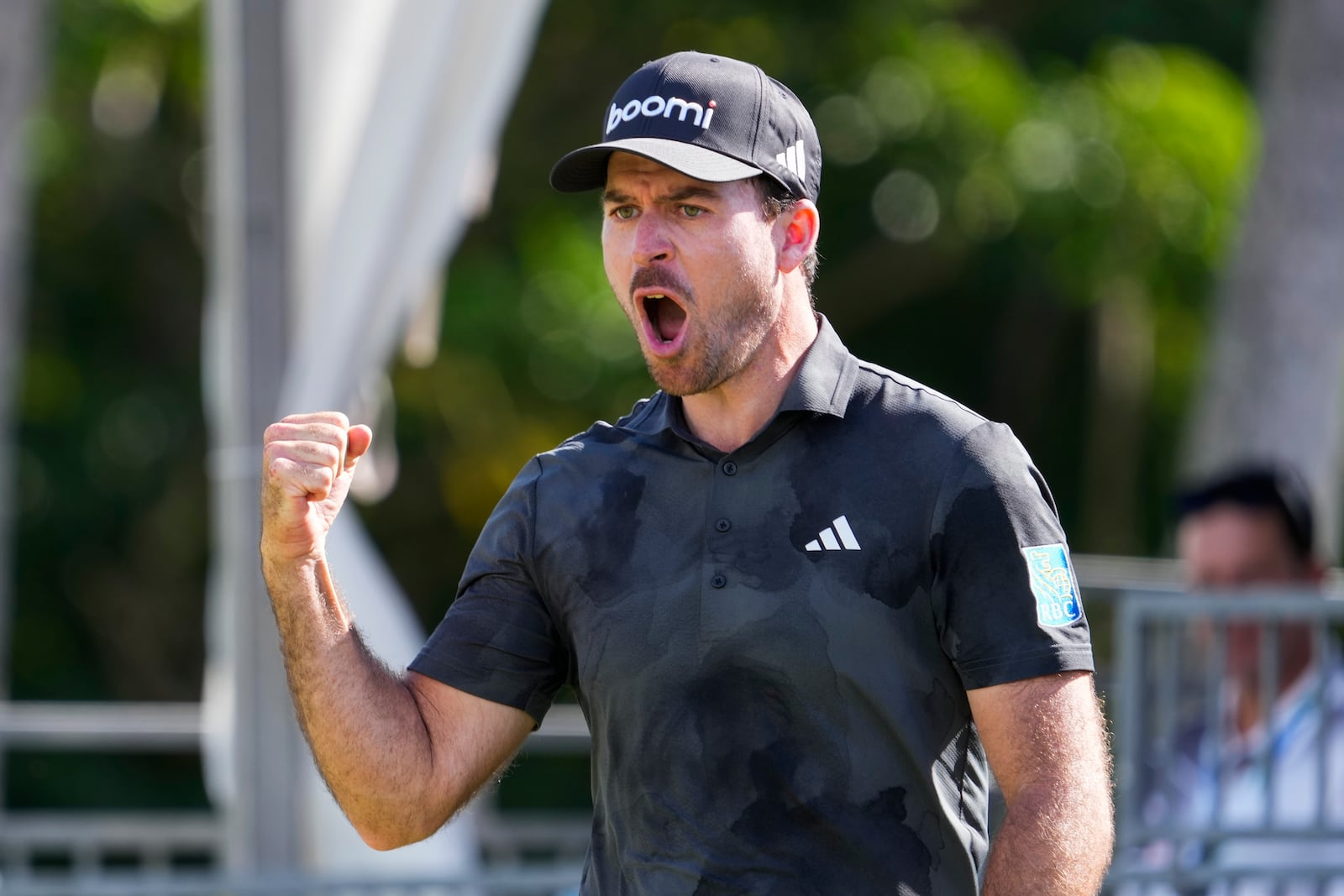 Nick Taylor, of Canada, celebrates after making a shot on the 18th green during the final round of the Sony Open golf event, Sunday, Jan. 12, 2025, at Waialae Country Club in Honolulu. (AP Photo/Matt York)