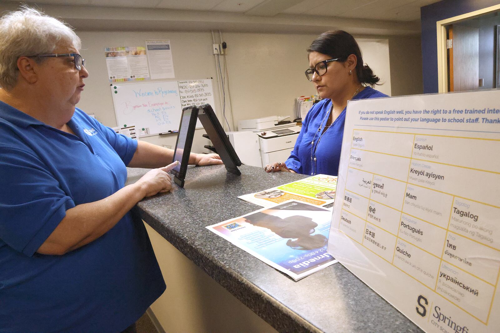 Dr. Pamela Shay and Lydia Martinez uses one of the Translate Live devices to have a conversation in the Springfield School District's central registration office Tuesday, August 27, 2024. BILL LACKEY/STAFF