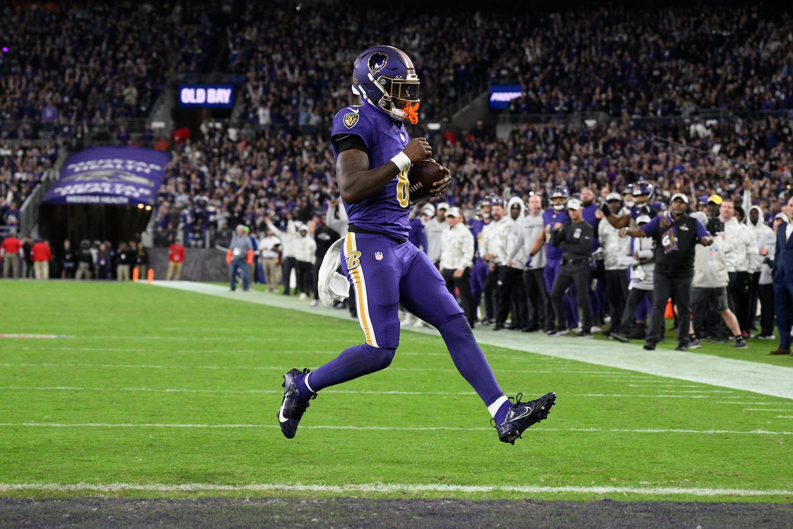 Baltimore Ravens quarterback Lamar Jackson scores a two-point conversion during the second half of an NFL football game against the Cincinnati Bengals, Thursday, Nov. 7, 2024, in Baltimore. (AP Photo/Nick Wass)