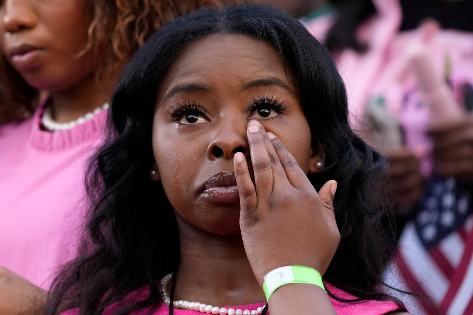 A supporter looks on as Vice President Kamala Harris delivers a concession speech for the 2024 presidential election, Wednesday, Nov. 6, 2024, on the campus of Howard University in Washington. (AP Photo/Susan Walsh)