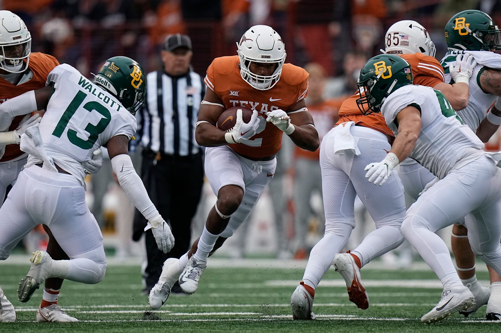 Texas running back Roschon Johnson (2) runs against Baylor during the second half of an NCAA college football game in Austin, Texas, Friday, Nov. 25, 2022. (AP Photo/Eric Gay)