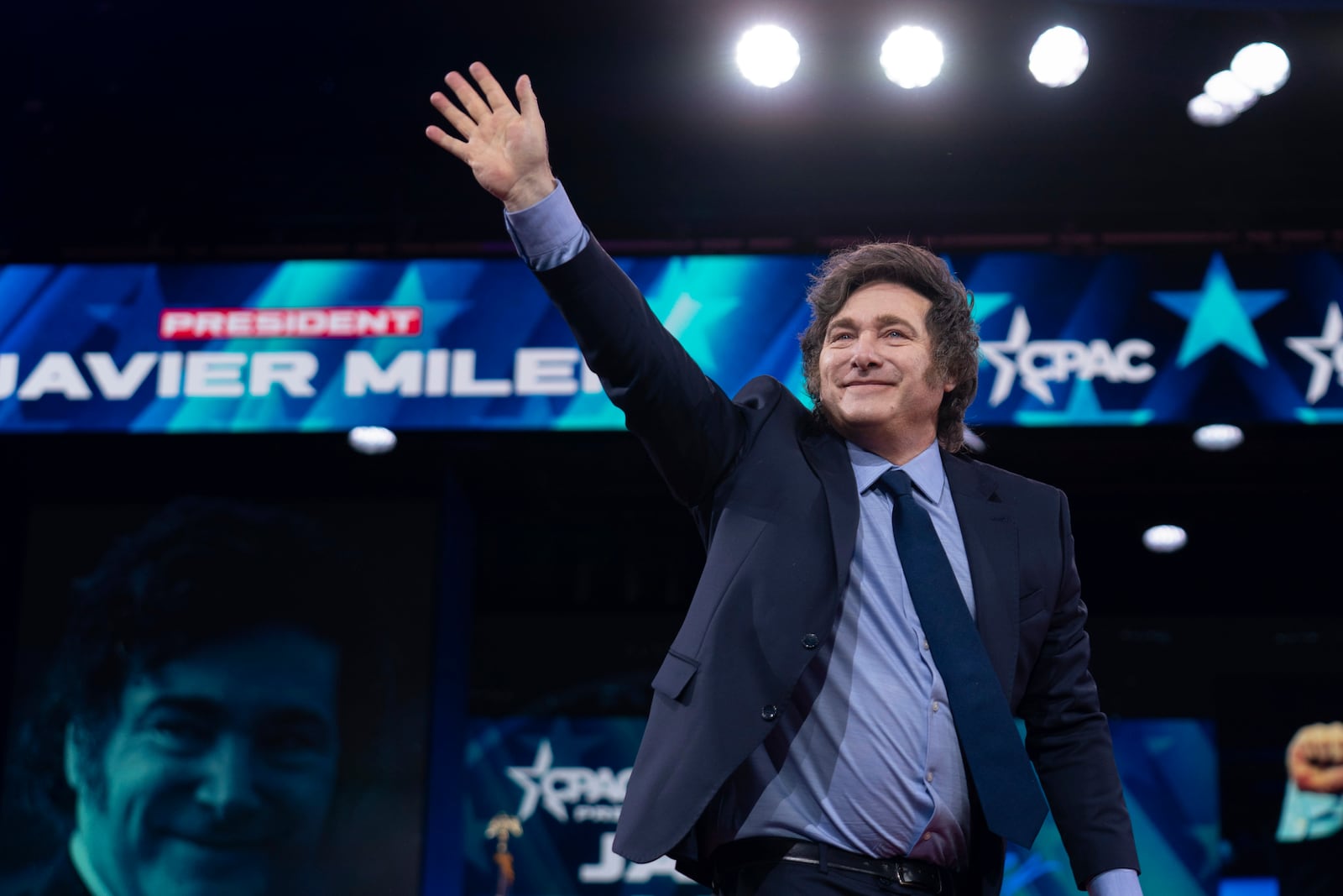 Argentina's President Javier Milei waves to the crowd before speaking at the Conservative Political Action Conference, CPAC, at the Gaylord National Resort & Convention Center, Saturday, Feb. 22, 2025, in Oxon Hill, Md. (AP Photo/Jose Luis Magana)