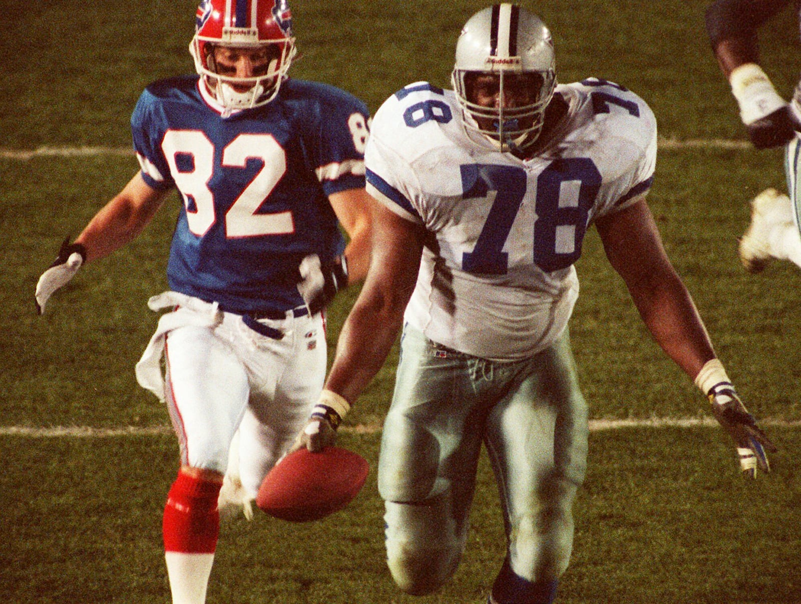 FILE - Dallas Cowboys Leon Lett (78) begins to celebrate too early as he heads for the goal line after recovering a Buffalo Bills fumble during Super Bowl XXVII, Jan. 31, 1993. (AP Photo/Douglas C. Pizac, File)