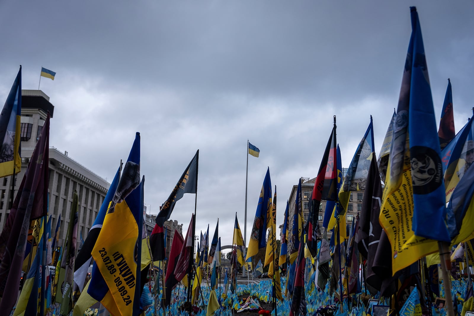 Flags placed in honour of fallen servicemen flutter in the wind in central Kyiv, Ukraine, Monday, Oct. 14, 2024. (AP Photo/Alex Babenko)