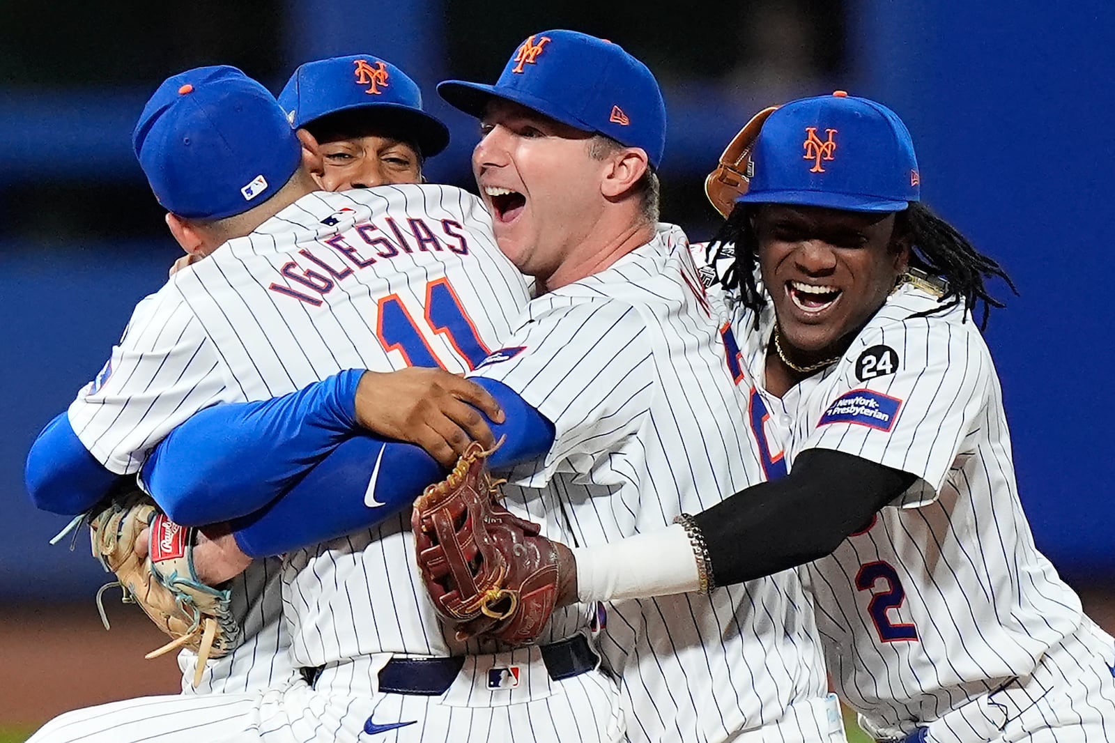 The New York Mets celebrate after defeating the Philadelphia Phillies in Game 4 of the National League baseball playoff series, Wednesday, Oct. 9, 2024, in New York. (AP Photo/Frank Franklin II)