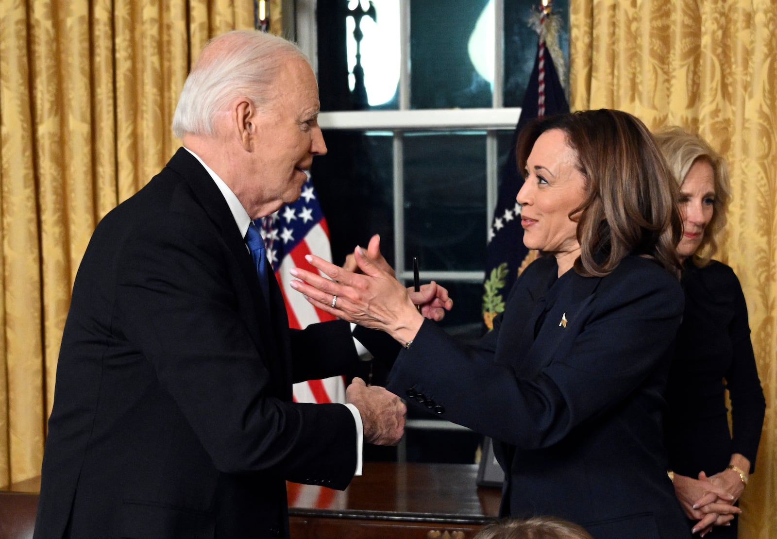 President Joe Biden greets Vice President Kamala Harris after he gave his farewell address from the Oval Office of the White House Wednesday, Jan. 15, 2025, in Washington. (Mandel Ngan/Pool via AP)