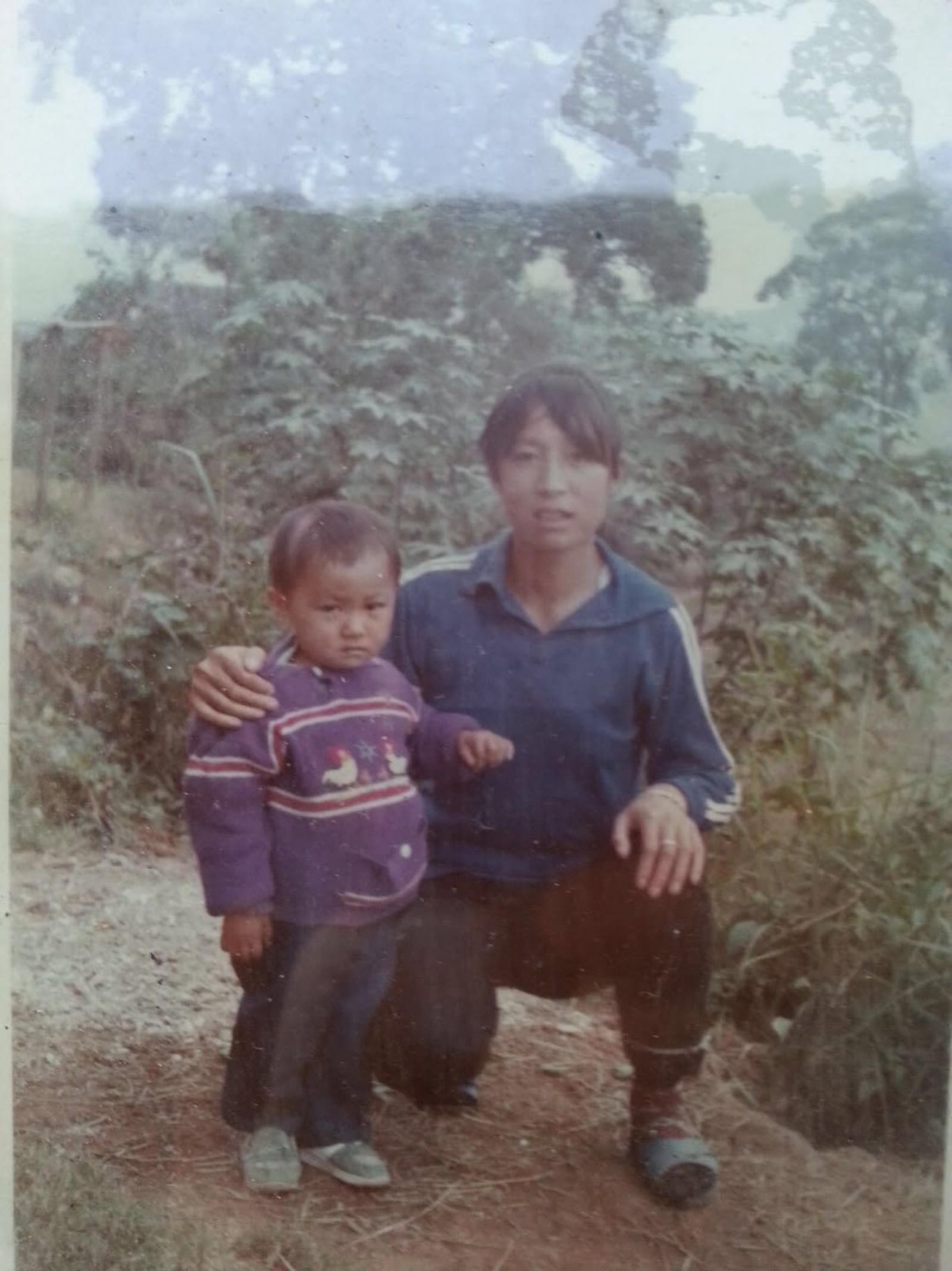 Lily Poynter, 14, of Centerville, discovered in 2016 that her birth mother, Huang He Gui Rong, died two weeks after giving birth. Here, Poynter’s mother is shown with another daughter, Lena.