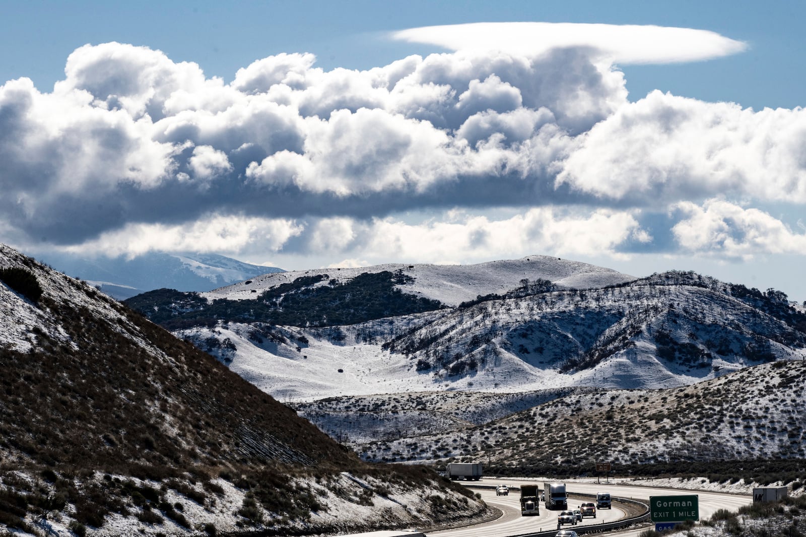 Snow covers the ground along the I-5 through Gorman and the Grapevine after Thursday's storm, on Friday, March 7, 2025. (David Crane/The Orange County Register via AP)