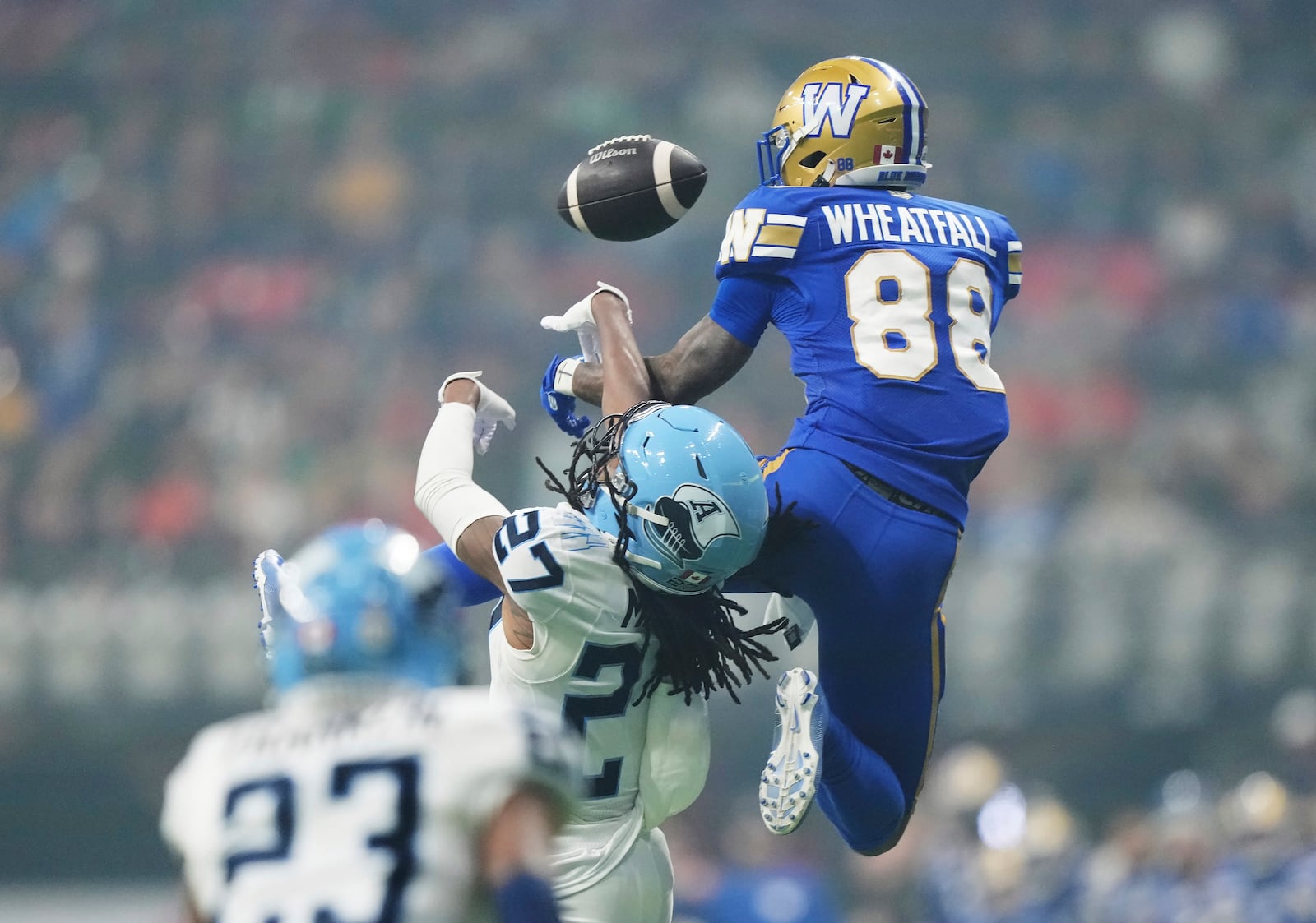 Winnipeg Blue Bombers' Keric Wheatfall (88) can't make the catch as Toronto Argonauts' Mark Milton (27) defends during the second half of a CFL football game at the 111th Grey Cup in Vancouver, British Columbia, Sunday, Nov. 17, 2024. (Nathan Denette/The Canadian Press via AP)