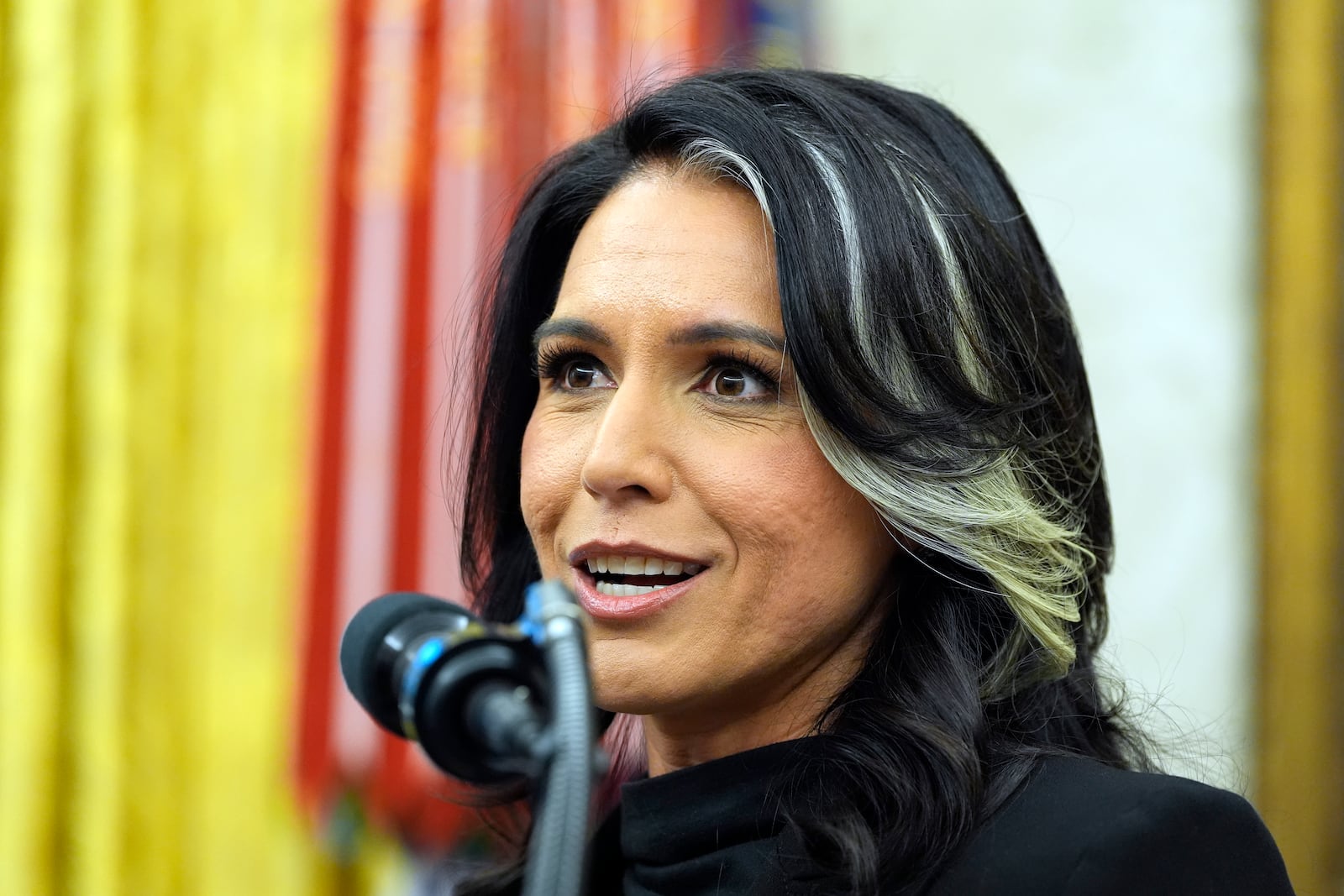 Tulsi Gabbard listens to President Donald Trump as she is sworn in as the Director of National Intelligence in the Oval Office of the White House, Wednesday, Feb. 12, 2025, in Washington. (Photo/Alex Brandon)