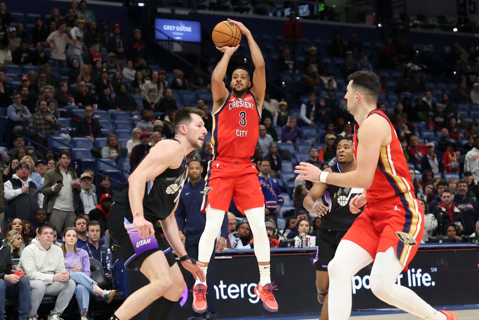 New Orleans Pelicans guard CJ McCollum (3)goes up to shoot a jumper over Utah Jazz guard Svi Mykhailiuk, left, in the second half of an NBA basketball game in New Orleans, Monday, Jan. 20, 2025. (AP Photo/Peter Forest)