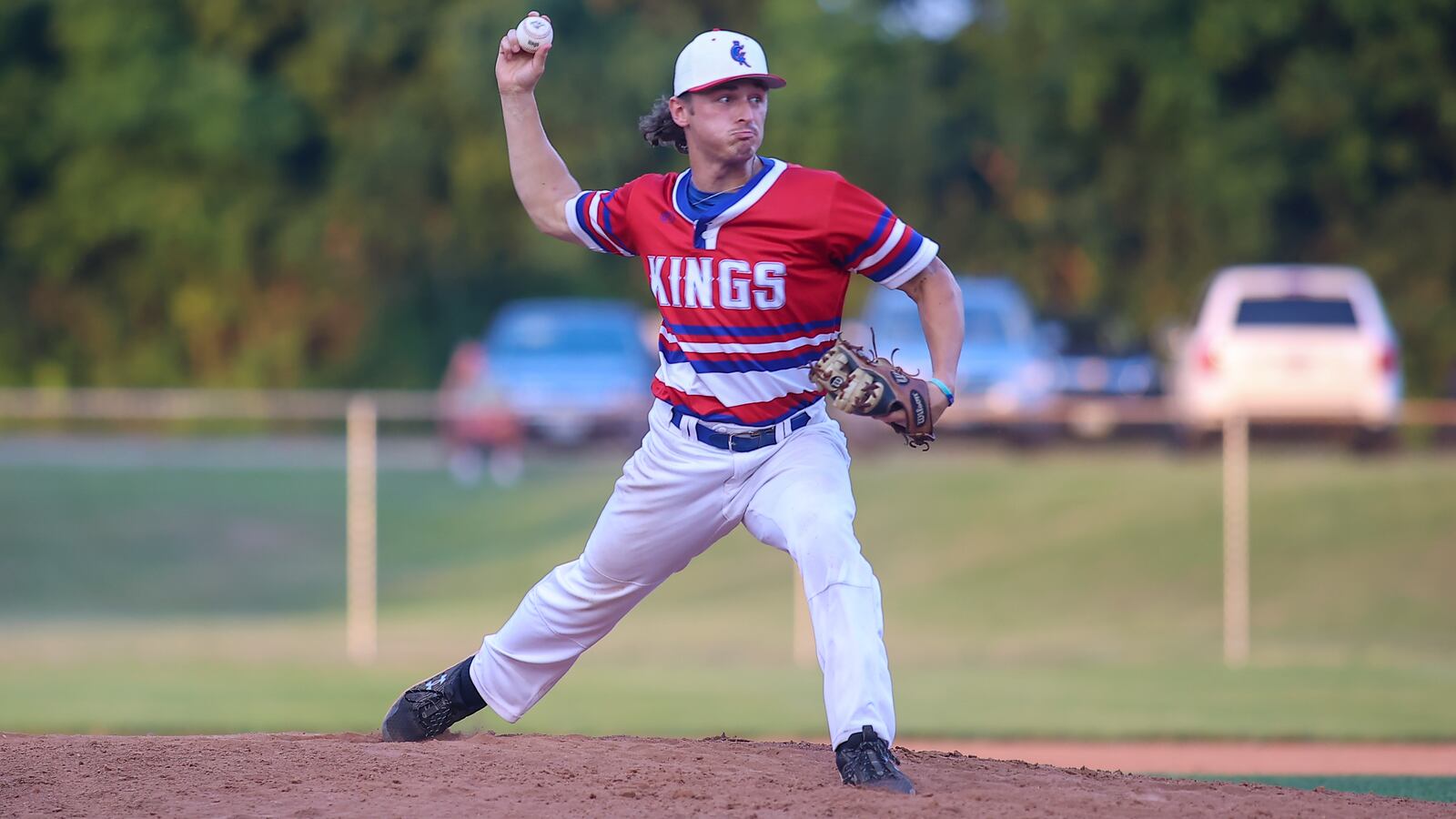 Cutline2: Champion City Kings pitcher and Northwestern grad Gage Voorhees motions to the plate during their 10-9 victory over the Chillicothe Paints on Thursday night at Carleton Davidson Stadium in Springfield. Michael Cooper/CONTRIBUTED