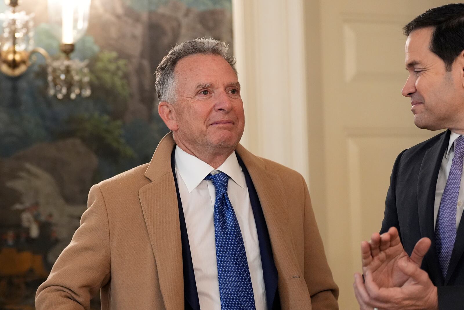 White House national security adviser Mike Walz watches as Secretary of State Marco Rubio applauds as President Donald Trump, accompanied by Marc Fogel, speak in the Diplomatic Reception Room at the White House, Tuesday, Feb. 11, 2025, in Washington. (Photo/Alex Brandon)