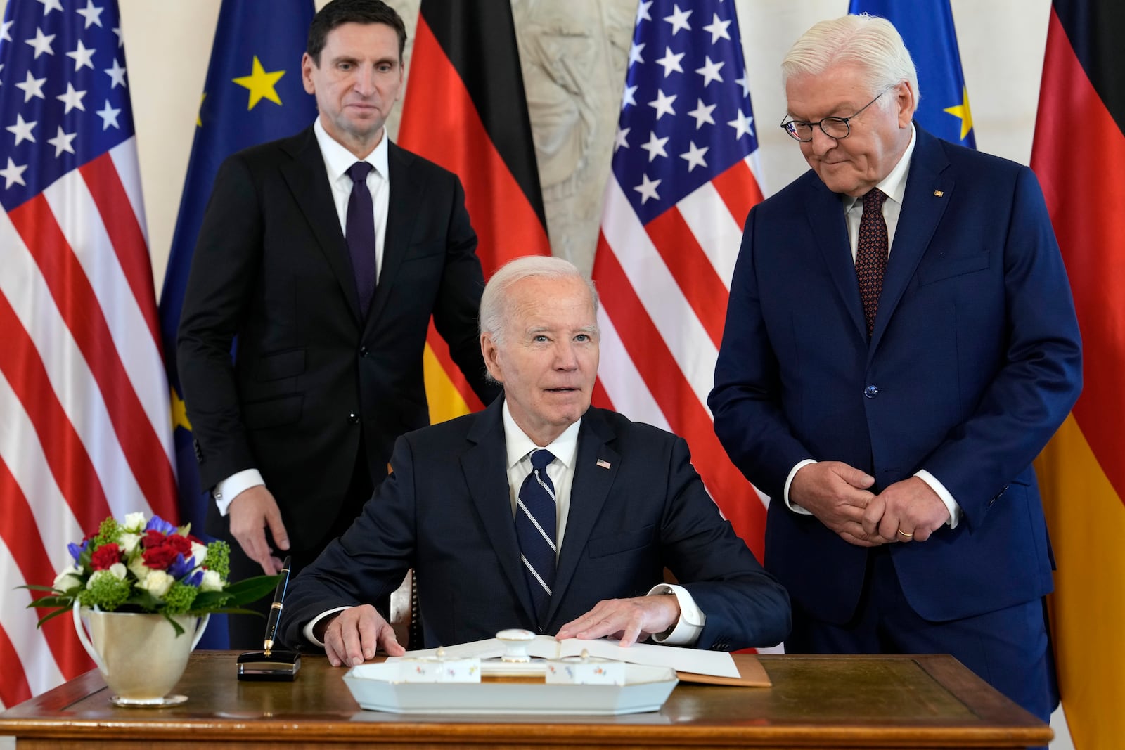 President Joe Biden is greeted by German President Frank-Walter Steinmeier, right, during the welcoming ceremony at Bellevue Palace in Berlin, Germany, Friday, Oct. 18, 2024. (AP Photo/Ben Curtis)