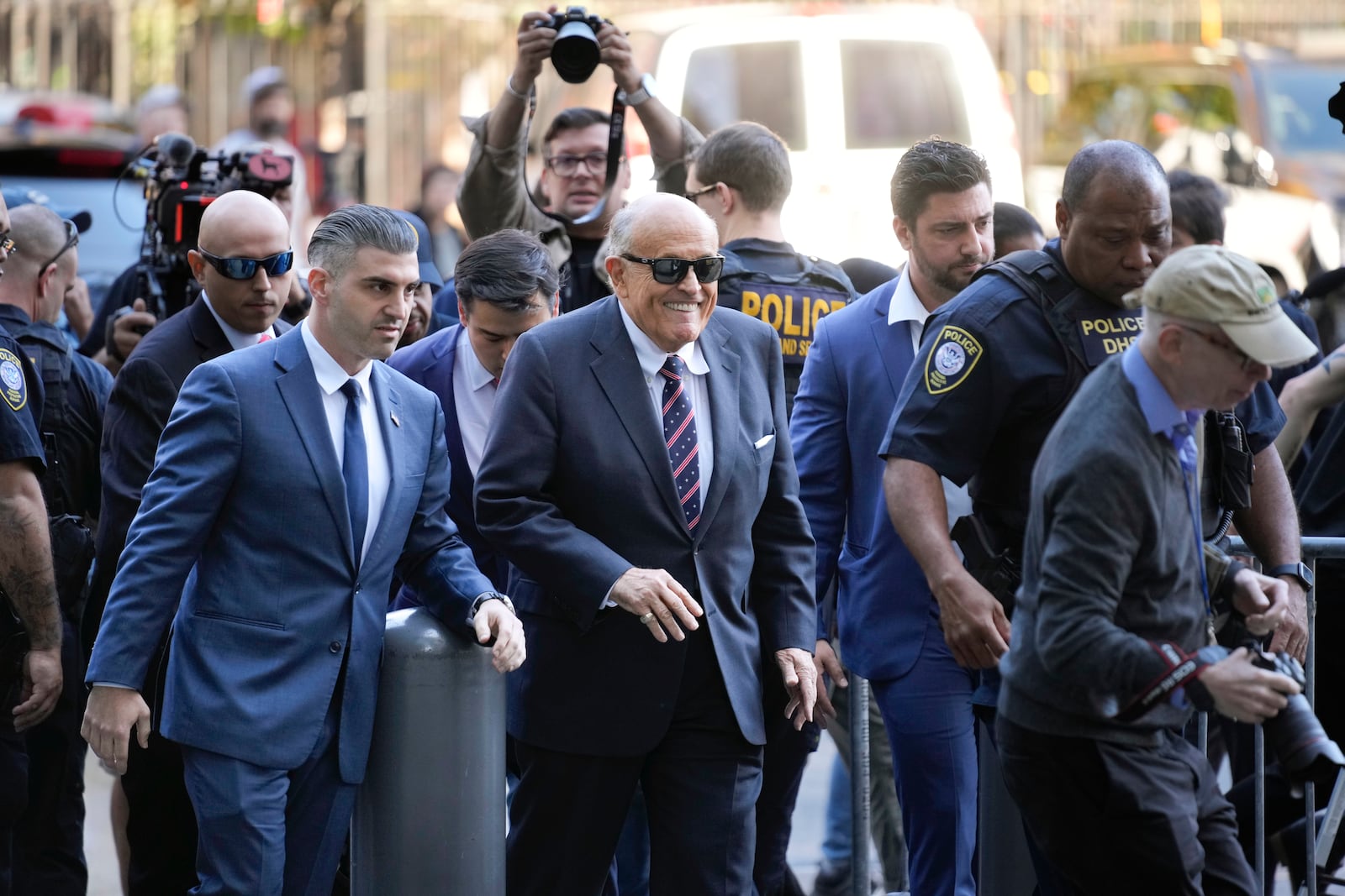 Rudy Giuliani, center, arrives to federal court in New York, Thursday, Nov. 7, 2024. (AP Photo/Seth Wenig)