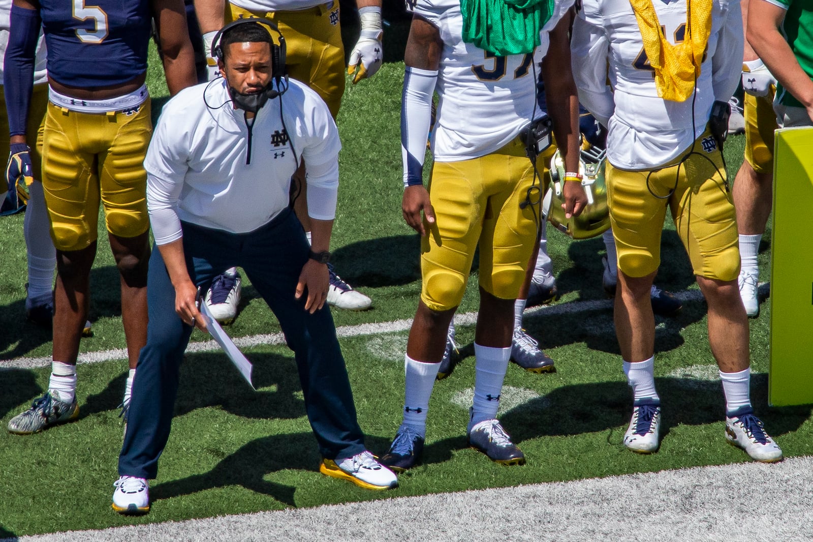 FILE - in this May 1, 2021, file photo, Notre Dame defensive coordinator Marcus Freeman watches during the Blue-Gold NCAA spring football game in South Bend, Ind. As Notre Dame linebacker Drew White ran into the Wisconsin end zone for the second Irish pick-six in two minutes, the identity of defensive coordinator Marcus Freeman’s unit had never been clearer.  On full display at Soldier Field on Saturday was the lauded defense that has garnered so much praise from Freeman’s players since he was hired in January. (AP Photo/Robert Franklin, File)