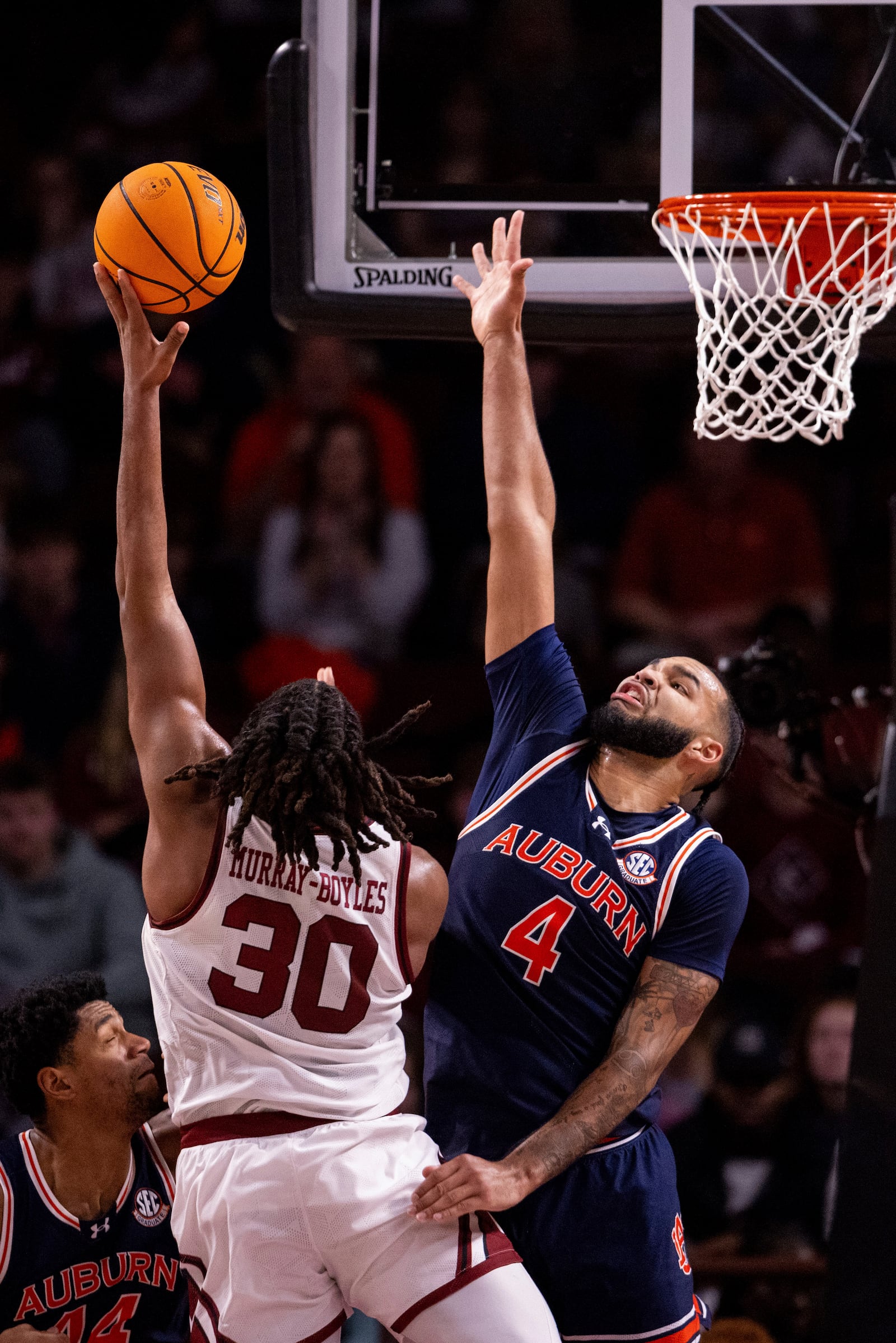 Carolina forward Collin Murray-Boyles, left, shoots over Auburn's Johni Broome (4) during the first half of an NCAA college basketball game on Saturday, Jan. 11, 2025, in Columbia, S.C. (AP Photo/Scott Kinser)