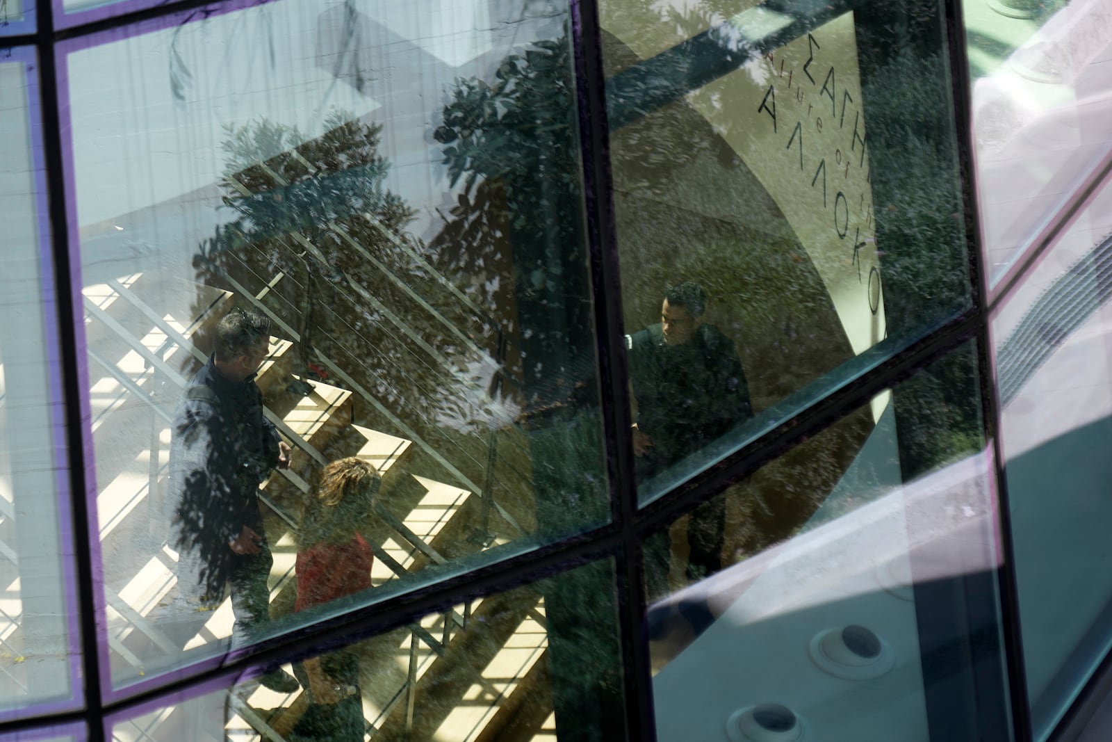 Greek police officers walk inside the National Gallery, as Nikolaos Papadopoulos, member of parliament of the small right-wing Niki party has detained after he allegedly attacked art works being hosted at the exhibition, in Athens, Greece, Monday, March 10, 2025. (AP Photo/Thanassis Stavrakis)