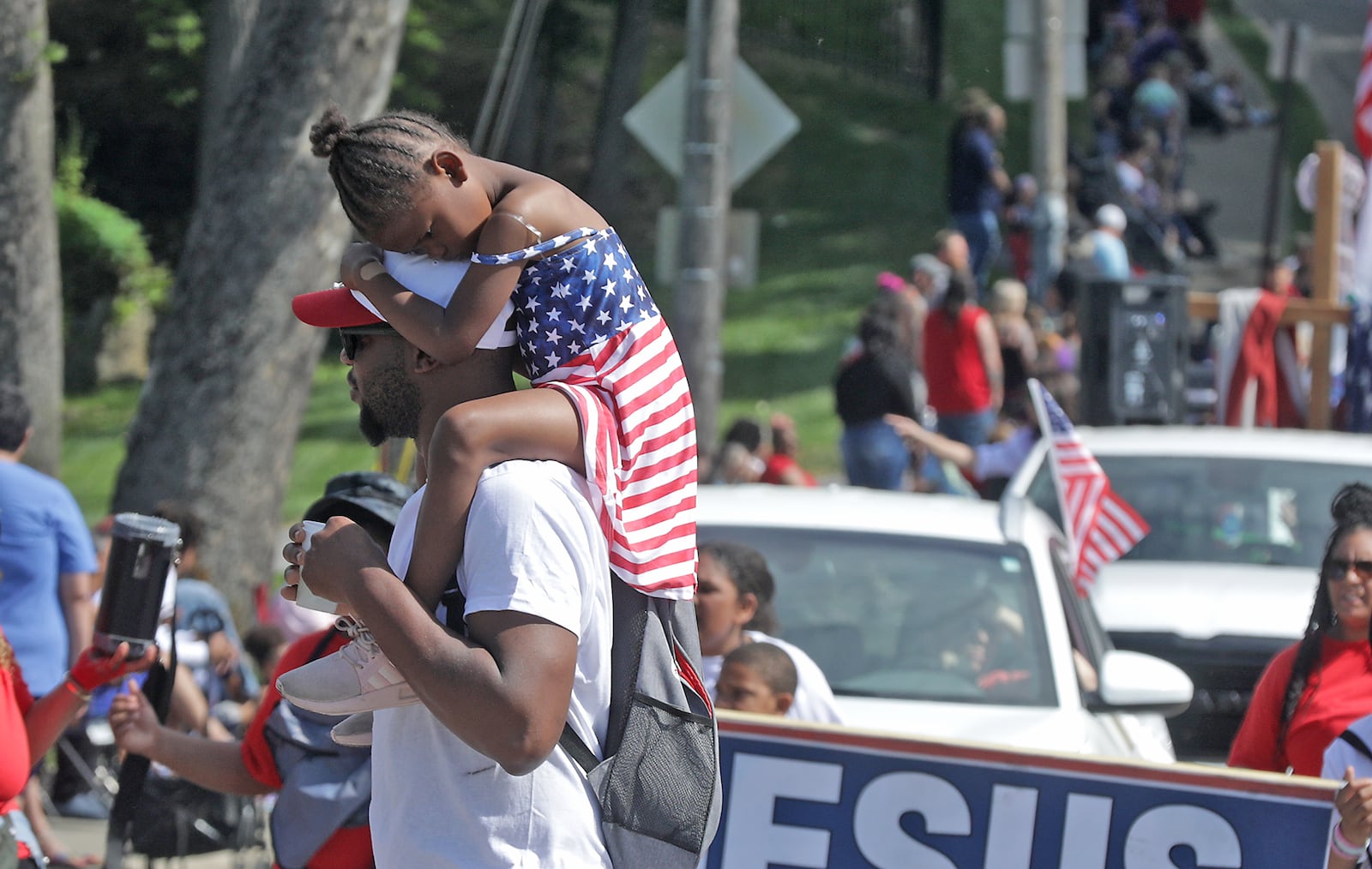 Thousands of people lined the parade route in their red, white and blue regalia to watch the 2023 Springfield Memorial Day Monday, May 29, 2023. The parade, which featured floats, fire trucks and bands, began with the throwing of the ceremonial wreath into Buck Creek and the somber sound of TAPS playing to honor those who haven given their lives in service to our country. BILL LACKEY/STAFF