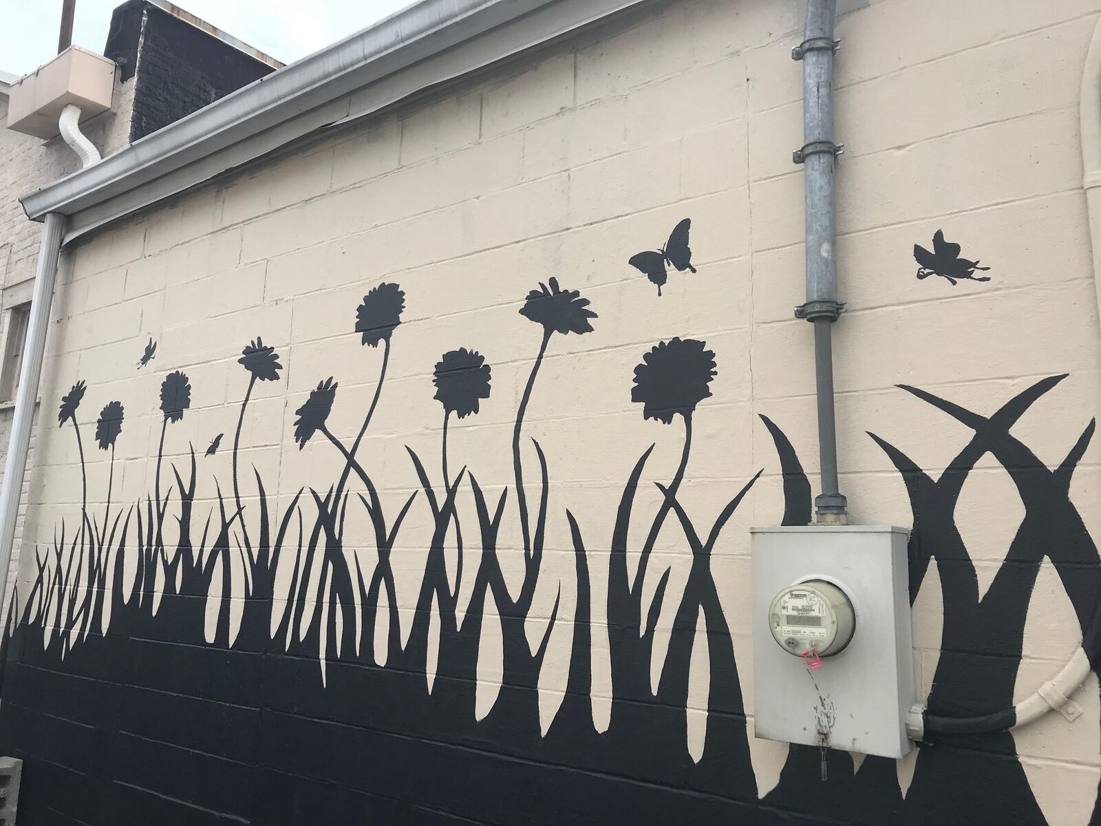 Nine flowers represent the nine victims of the Oregon District shooting.