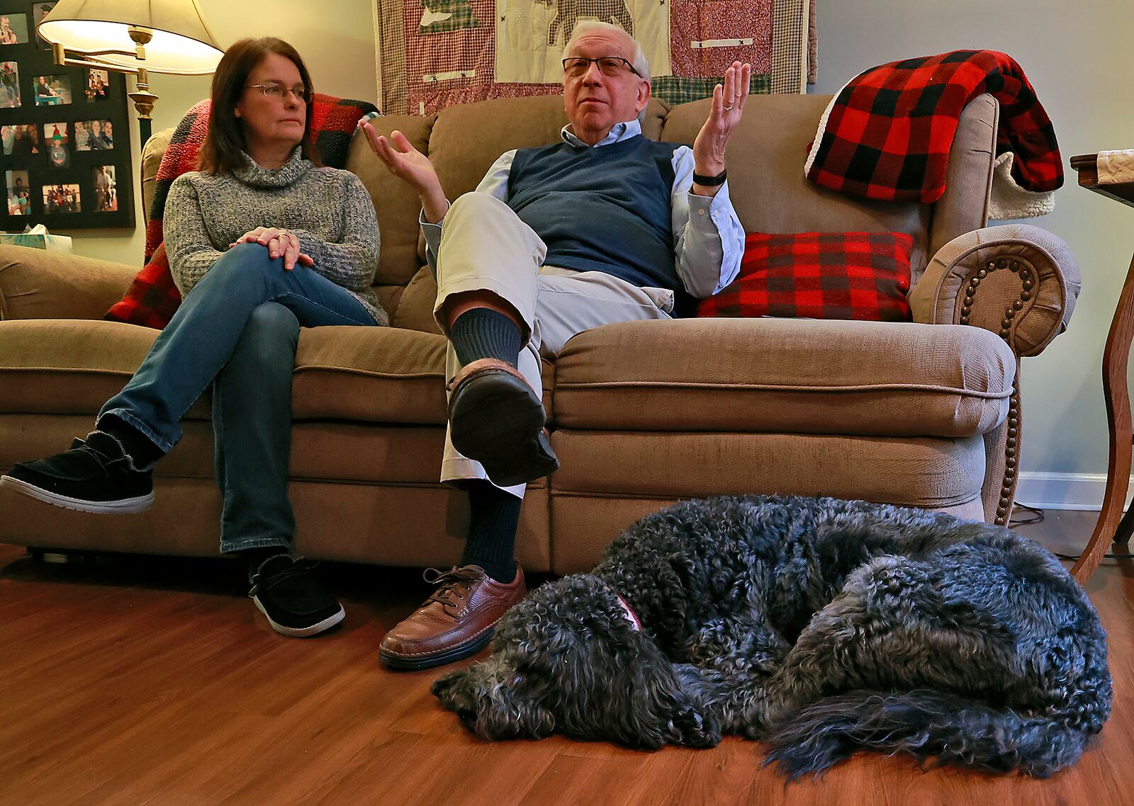 Scott Griswold and his wife, Karen, talk about Scott's Alzheimers diagnosis and the possibility of help from a new drug Thursday, Jan. 12, 2023. At Scott's feet is their dog, Driggs, who has helped Scott deal with the disease. BILL LACKEY/STAFF