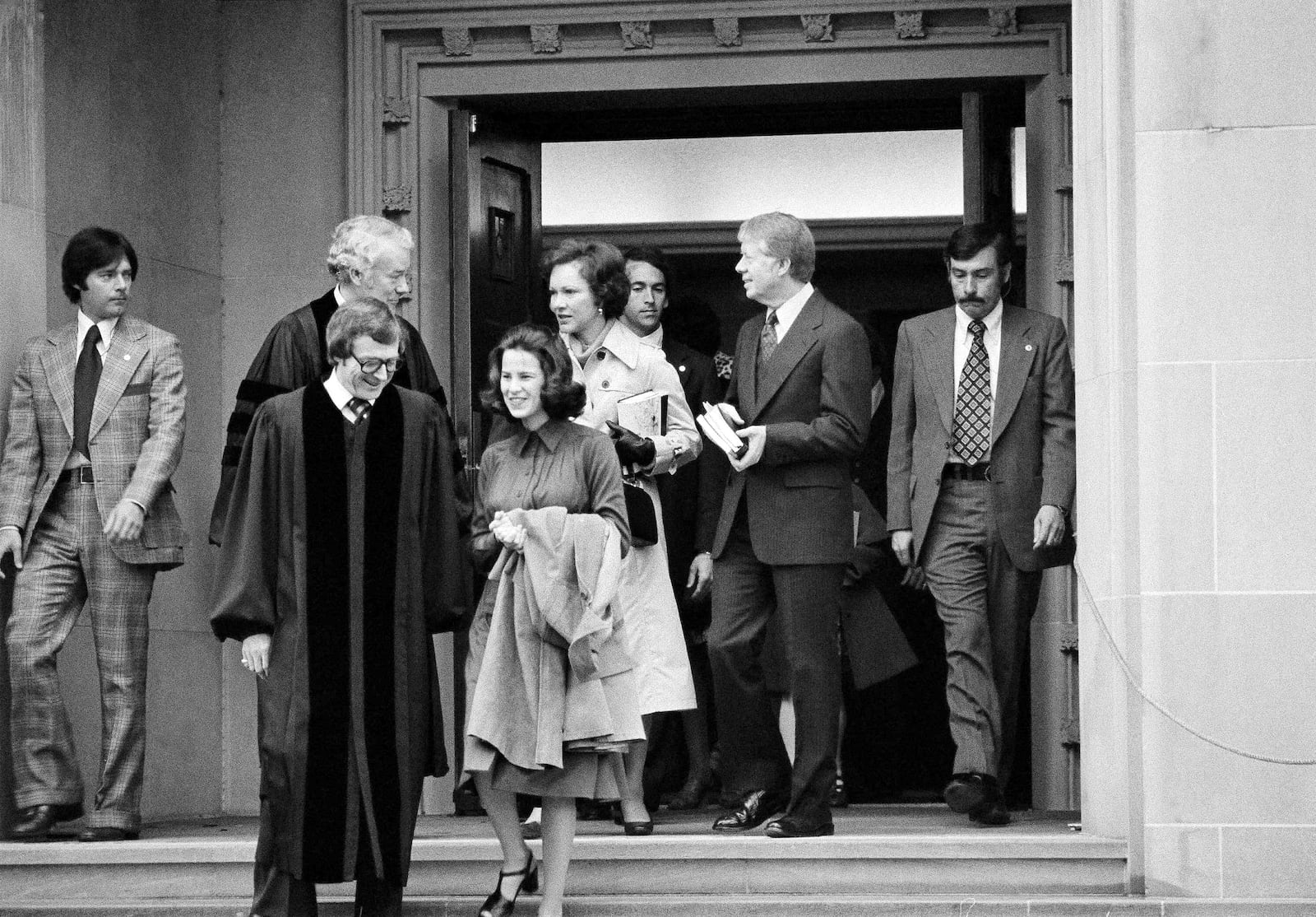 FILE - President Jimmy Carter and Rosalynn Carter chat with Rev. Charles Trentham as they leave the First Baptist Church in Washington on March 20, 1977. (AP Photo/Charles W. Harrity, File)