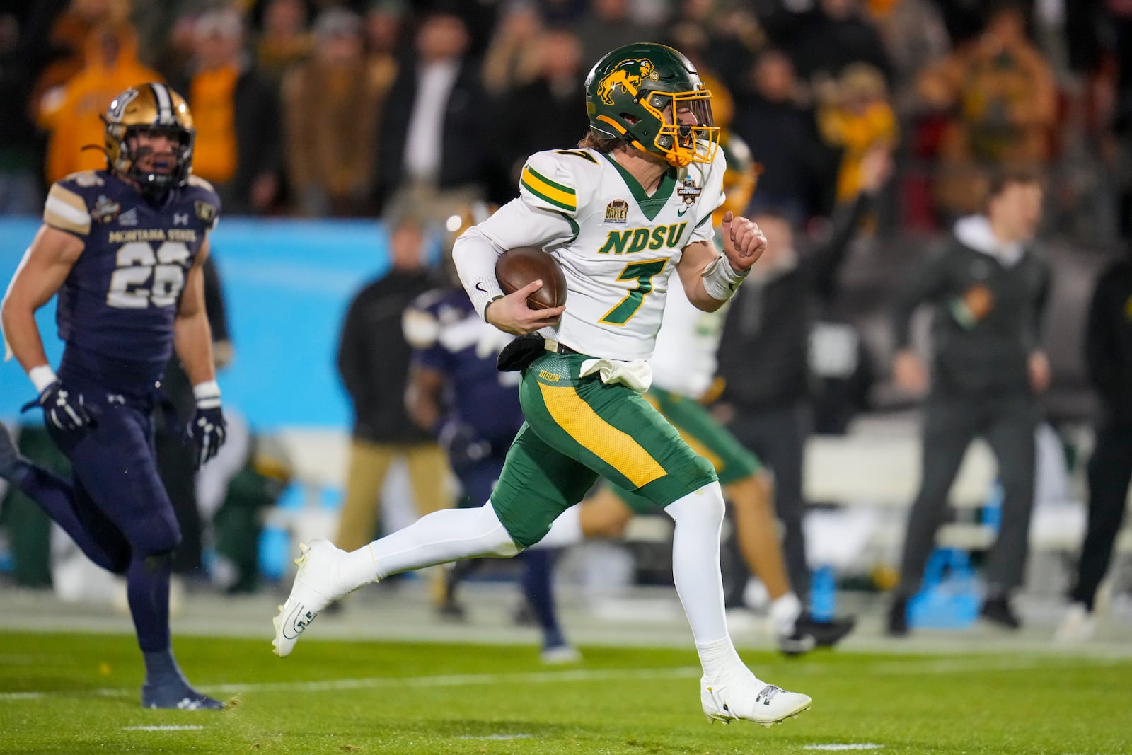 North Dakota State quarterback Cam Miller breaks away from Montana State defensive back Rylan Ortt for a long touchdown run during the first half of the FCS Championship NCAA college football game, Monday, Jan. 6, 2025, in Frisco, Texas. (AP Photo/Julio Cortez)