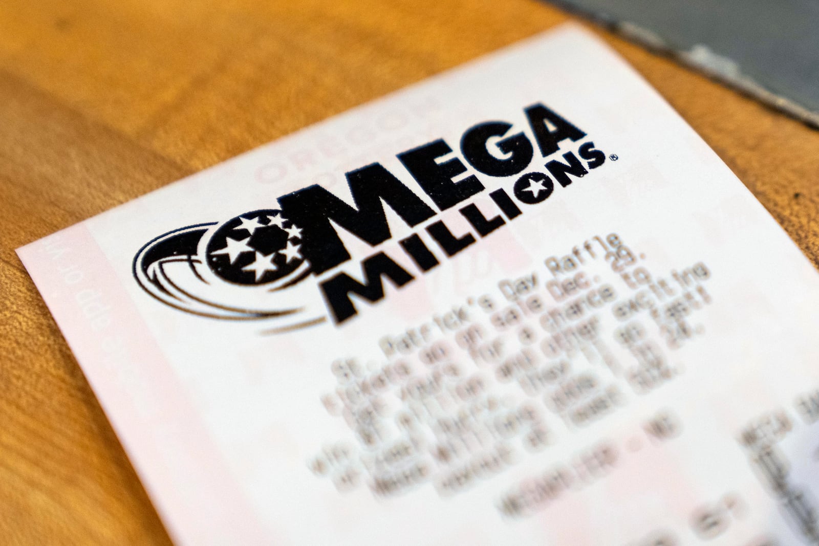 A Mega Millions lottery ticket is displayed at a store on Thursday, Dec. 26, 2024, in Tigard, Ore. (AP Photo/Jenny Kane)