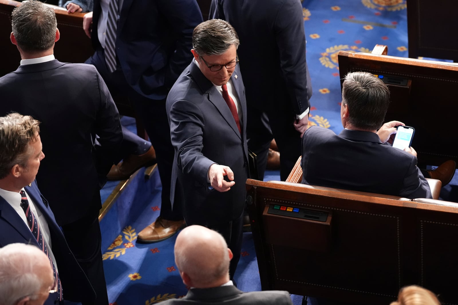 House Speaker Mike Johnson, R-La., greets members as the House of Representatives meets to elect a speaker and convene the new 119th Congress at the Capitol in Washington, Friday, Jan. 3, 2025. (AP Photo/Jacquelyn Martin)