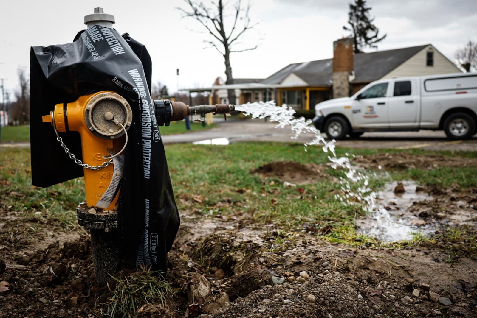 A water hydrant is flushed after pipes were replaced as part of a water system maintenance project. Water distributors in southwest Ohio said rising maintenance and operating costs are factors in customer water rate increases. JIM NOELKER/STAFF