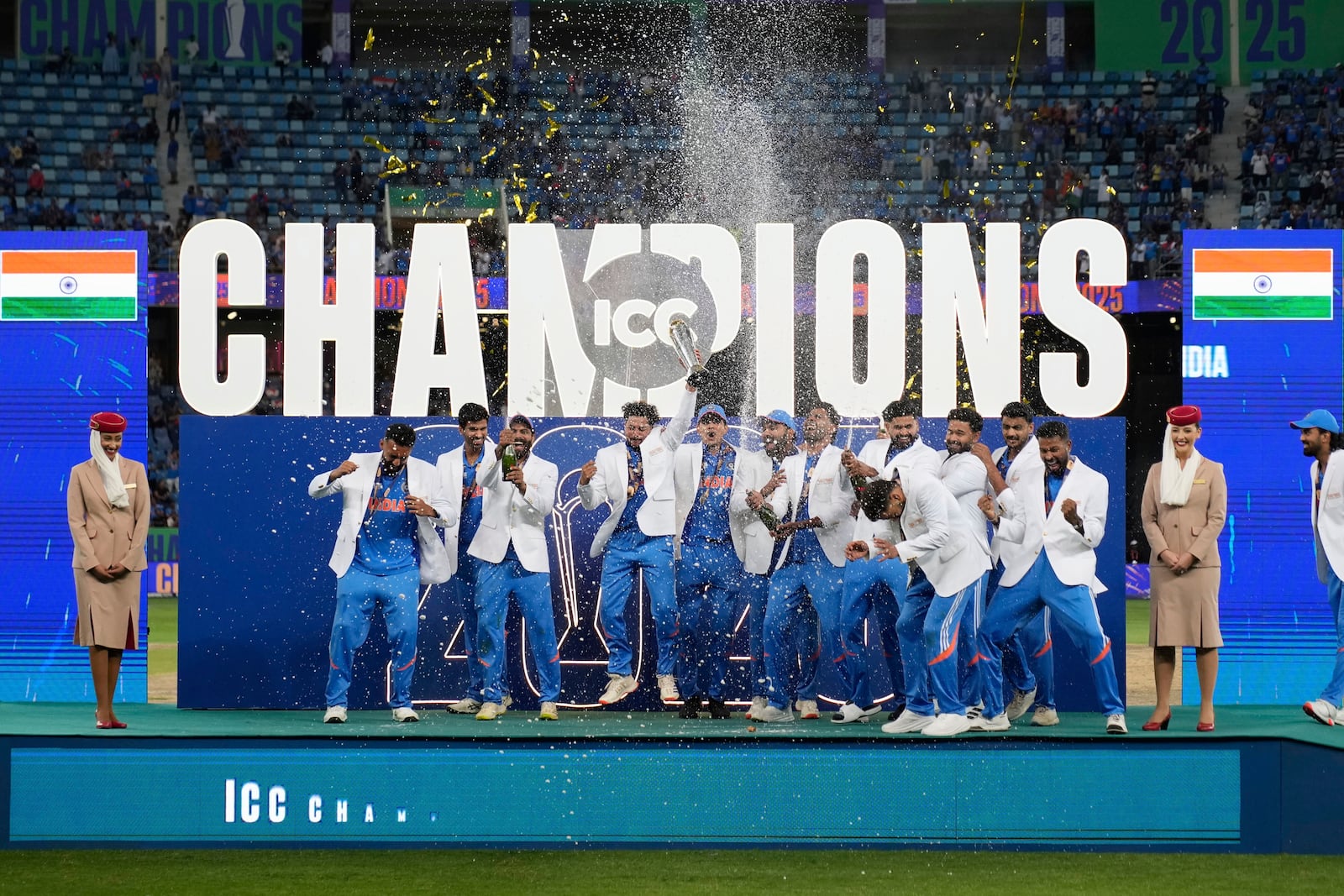 India's players celebrate after winning the ICC Champions Trophy final cricket match against New Zealand at Dubai International Cricket Stadium in Dubai, United Arab Emirates, Sunday, March 9, 2025. (AP Photo/Altaf Qadri)