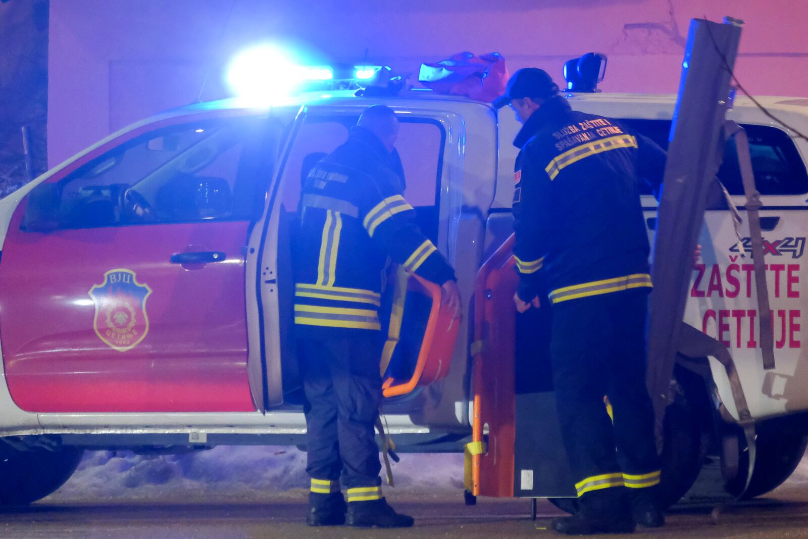 Rescue workers work at the site of a shooting in Cetinje, 36 kilometers (22 miles) west of Podogrica, Montenegro, Wednesday, Jan 1, 2025. (AP Photo/Risto Bozovic)