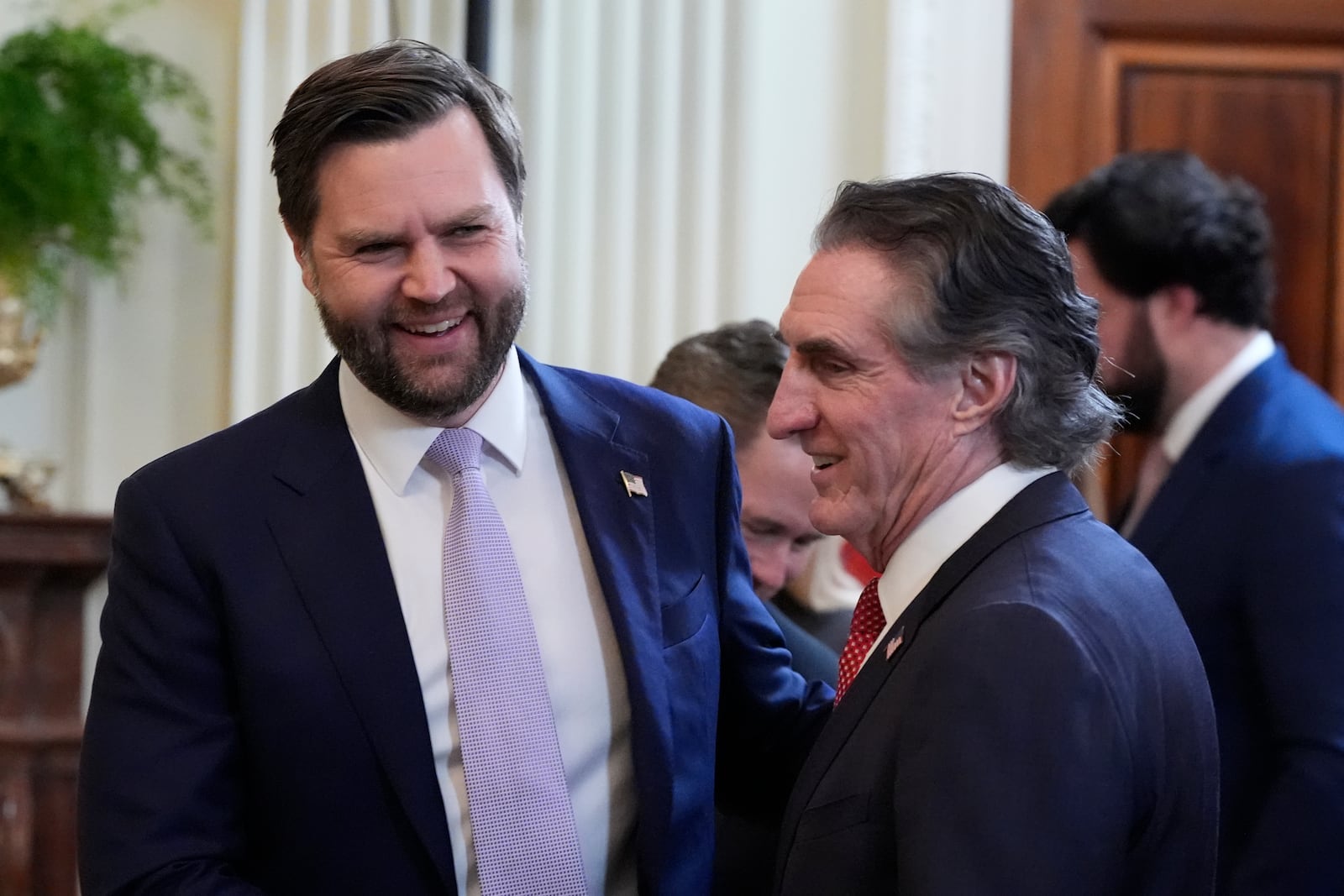 Vice President JD Vance, left, talks with Secretary of Interior Doug Burgum before President Donald Trump and Japanese Prime Minister Shigeru Ishiba arrive to hold a news conference in the East Room of the White House, Friday, Feb. 7, 2025, in Washington. (AP Photo/Alex Brandon)