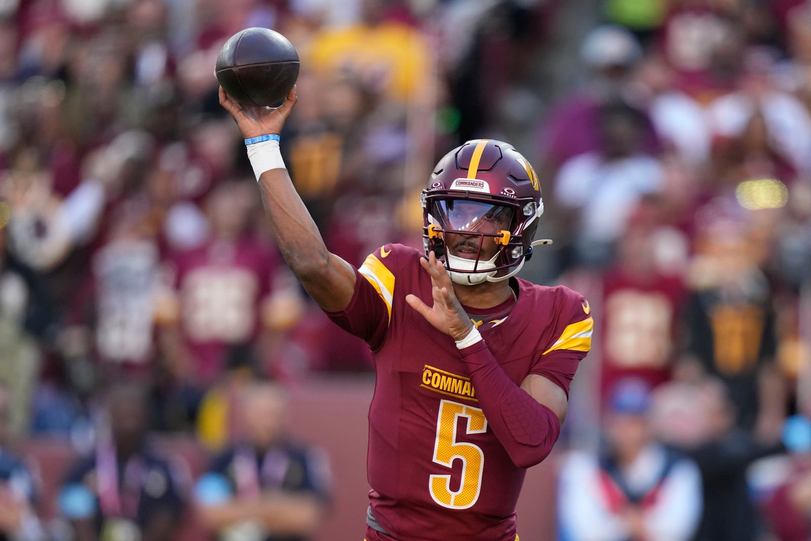 Washington Commanders quarterback Jayden Daniels throws a pass during the first half of an NFL football game against the Carolina Panthers, Sunday, Oct. 20, 2024, in Landover, Md. (AP Photo/Stephanie Scarbrough)