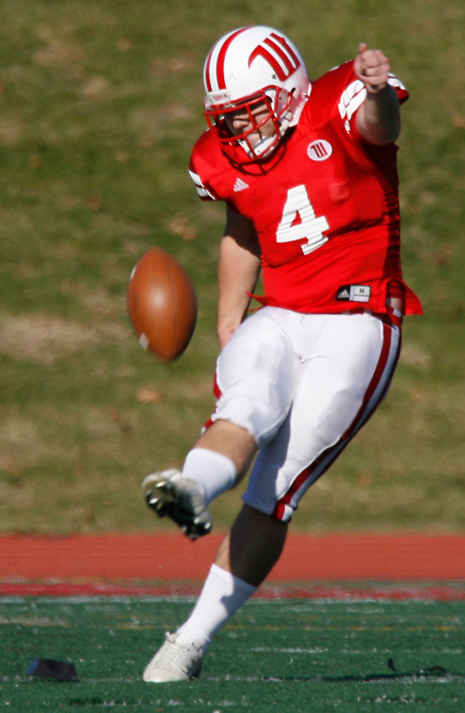 Zack Harris (4) of Wittenberg kicks off for the Tigers during Saturday's game against Wooster at Edwards-Maurer Field. Wittenberg won the game 42-6.Staff Photo by Barbara J. Perenic