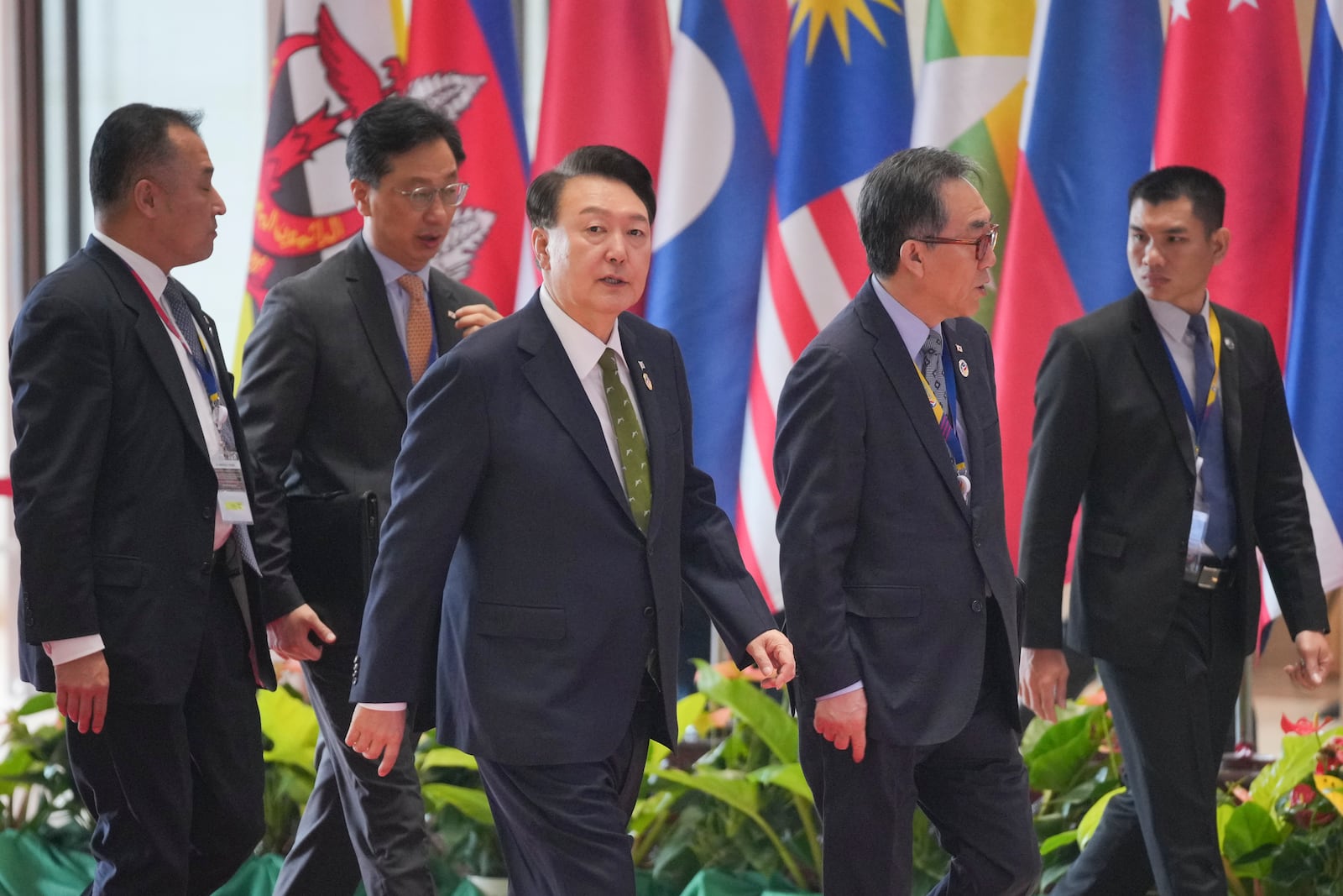 South Korean President Yoon Suk-yeol, center, arrives ahead of the 19th East Asia Summit in Vientiane, Laos, Friday, Oct. 11, 2024. (AP Photo/Dita Alangkara)