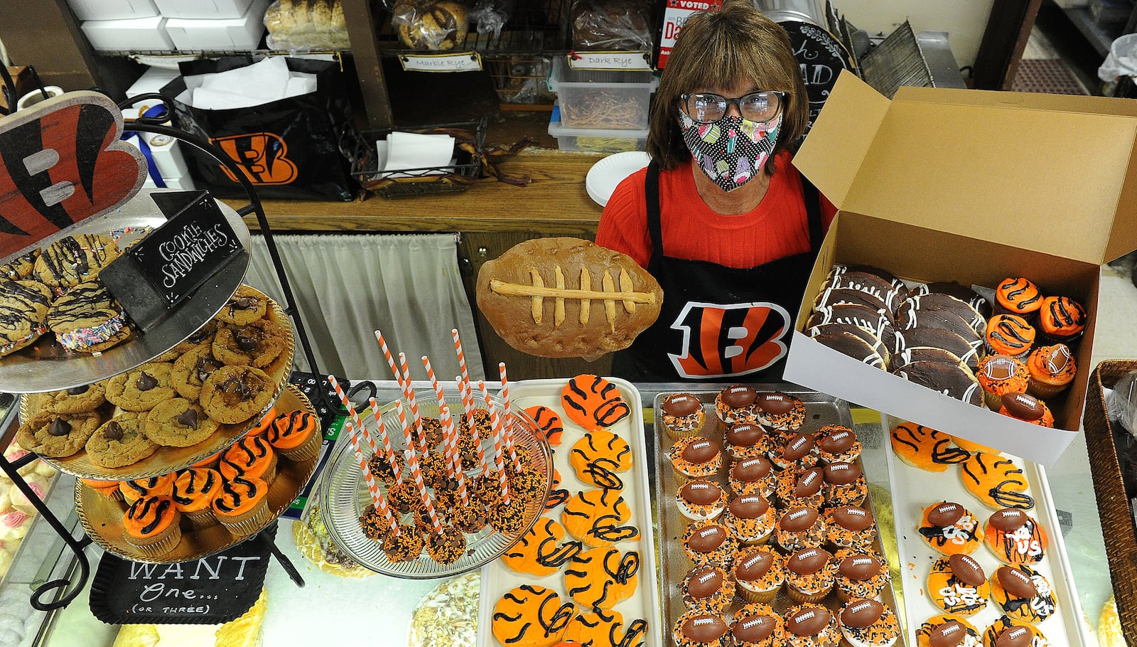 Theresa Hammons the owner of Ashley's Pastry Shop located at 21 Park Ave., Oakwood displays all the Bengal treats they have for sale. Football bread, cupcakes, cookies and cake pops.  MARSHALL GORBY\STAFF