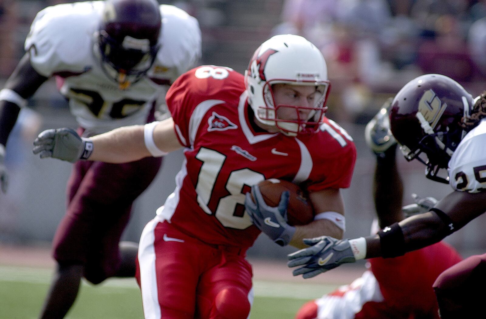 Miami University wide receiver Sean McVay fights off Central Michigan linebacker Jonathan Lapsley. FILE PHOTO