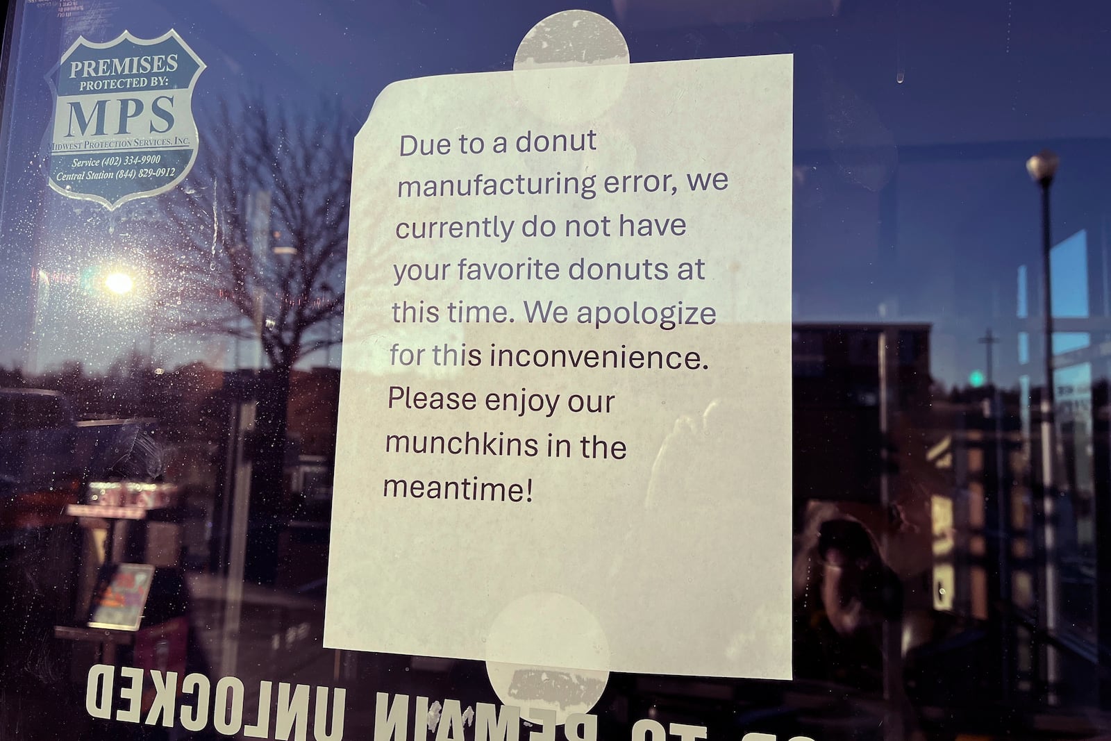 A sign on the door of a Dunkin' restaurant in west Omaha explains that customers will find no doughnuts for sale on Friday, Jan. 10, 2025. (AP Photo/Margery Beck)