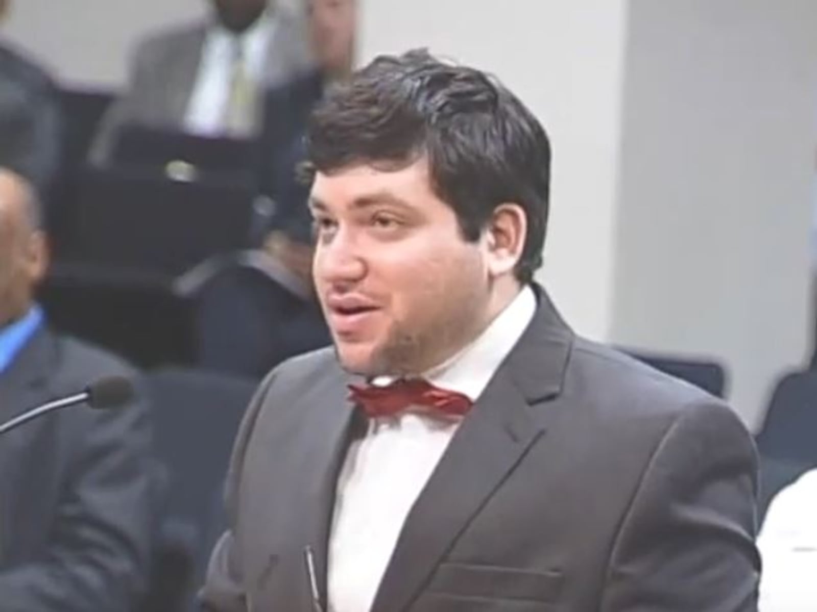 Nicholas Rossi, who also goes by the name Nicholas Alahverdian, speaks during a public comment portion of a Dayton City Commission meeting in August 2015. Rossi asked the commission to approve a resolution condemning the Armenian genocide. CONTRIBUTED