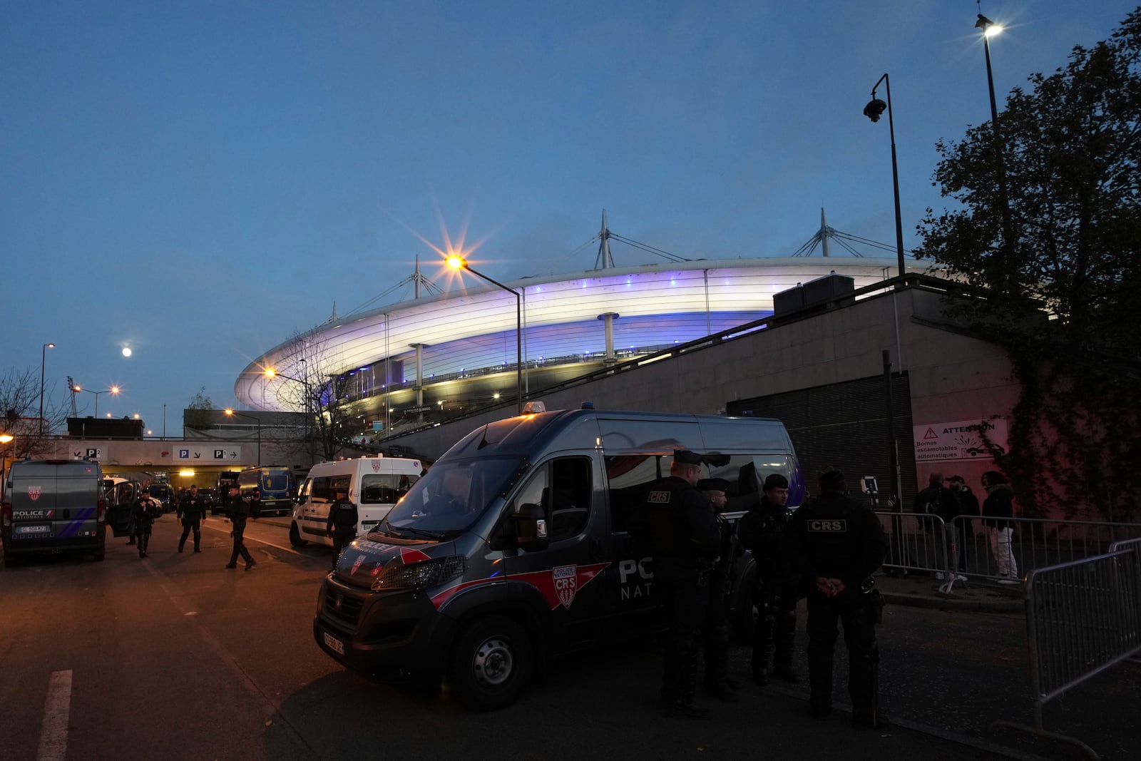 Police officers patrol in front of the stadium ahead of the Nations League soccer match France against Israel outside the Stade de France stadium, Thursday, Nov. 14, 2024 in Saint-Denis, outside Paris. (AP Photo/Aurelien Morissard)