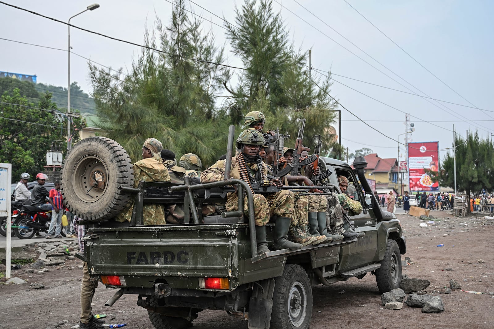 M23 rebels escort government soldiers and police who surrendered to an undisclosed location in Goma, Democratic republic of the Congo, Thursday, Jan. 30, 2025. (AP Photo/Moses Sawasawa)