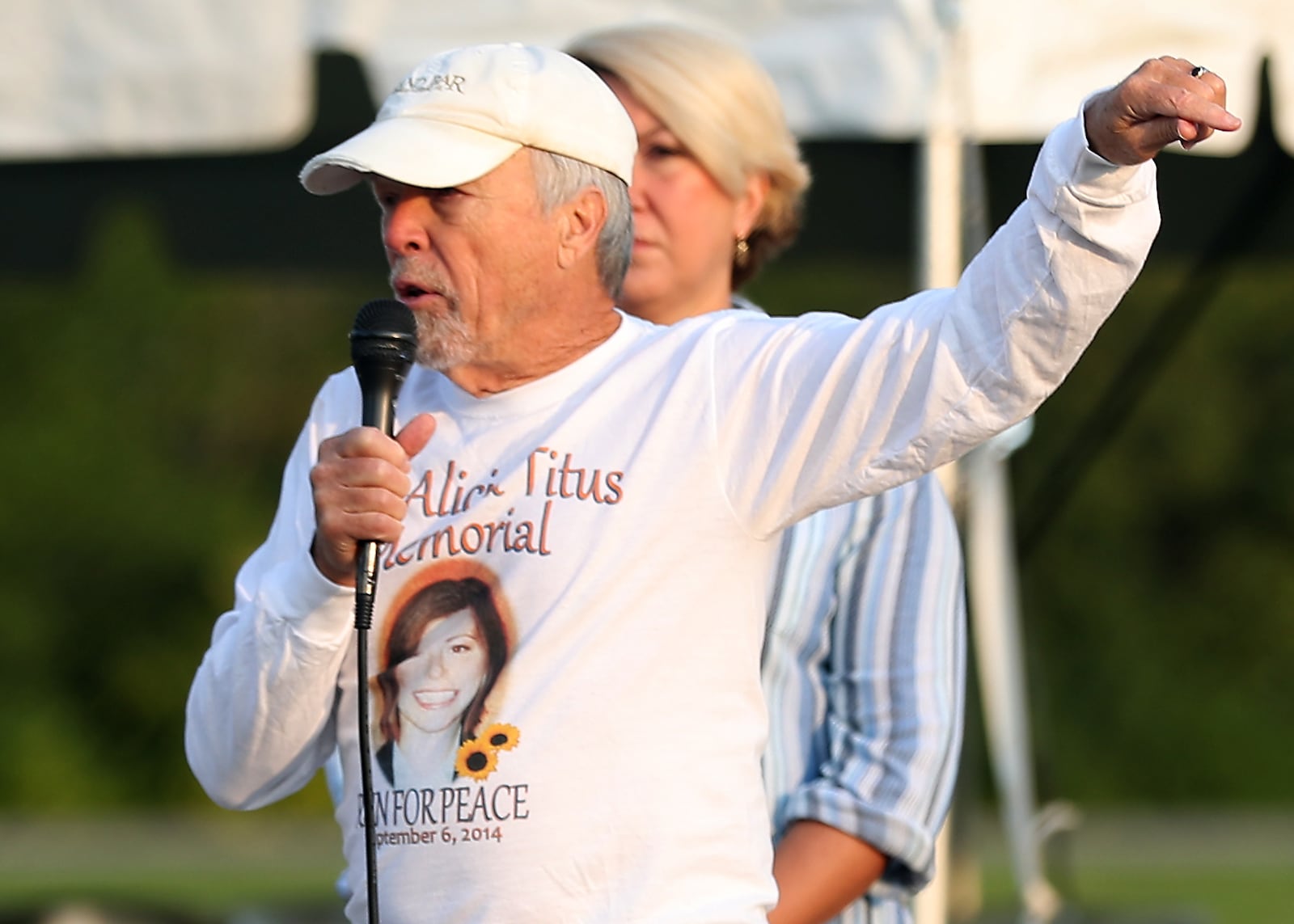 John Titus, father of Alicia Titus who was a flight attendant on the second plane to strike the World Trade Center, speaks at a 9/11 remembrance ceremony Saturday in Urbana. BILL LACKEY/STAFF