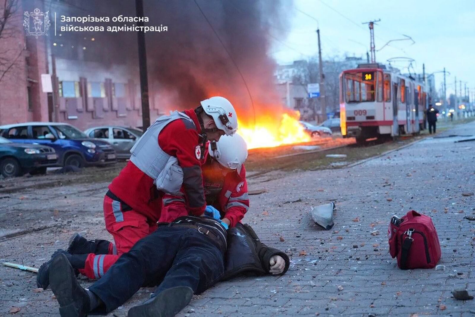 In this photo provided by the Zaporizhzhia regional military administration on Jan. 8, 2025, paramedics work to resuscitate a man injured in a Russian air strike in Zaporizhzhia, Ukraine. (Zaporizhzhia regional military administration via AP)