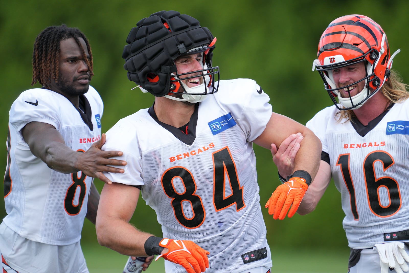 Cincinnati Bengals wide receiver Mike Thomas, left, tight end Mitchell Wilcox (84) and wide receiver Trenton Irwin (16) participate in a drill during NFL football training camp Wednesday, Aug. 10, 2022, in Cincinnati. (AP Photo/Jeff Dean)