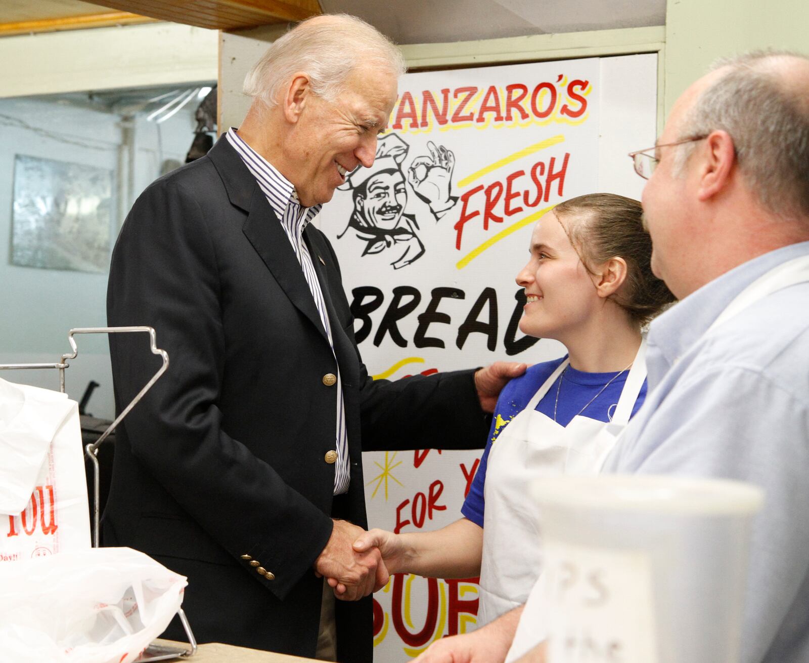 Then-Vice President Joe Biden made an unannounced stop in Springfield on Oct. 23, 2012, after a rally in Dayton with President Barack Obama. Biden traveled to Catanzaro's Pizza and Subs, greeting employees and picking up 15 pizzas, which he delivered to campaign volunteers at the local Obama For America office on Bechtle Avenue.
(AP Photo/Barbara J. Perenic, Springfield News-Sun)