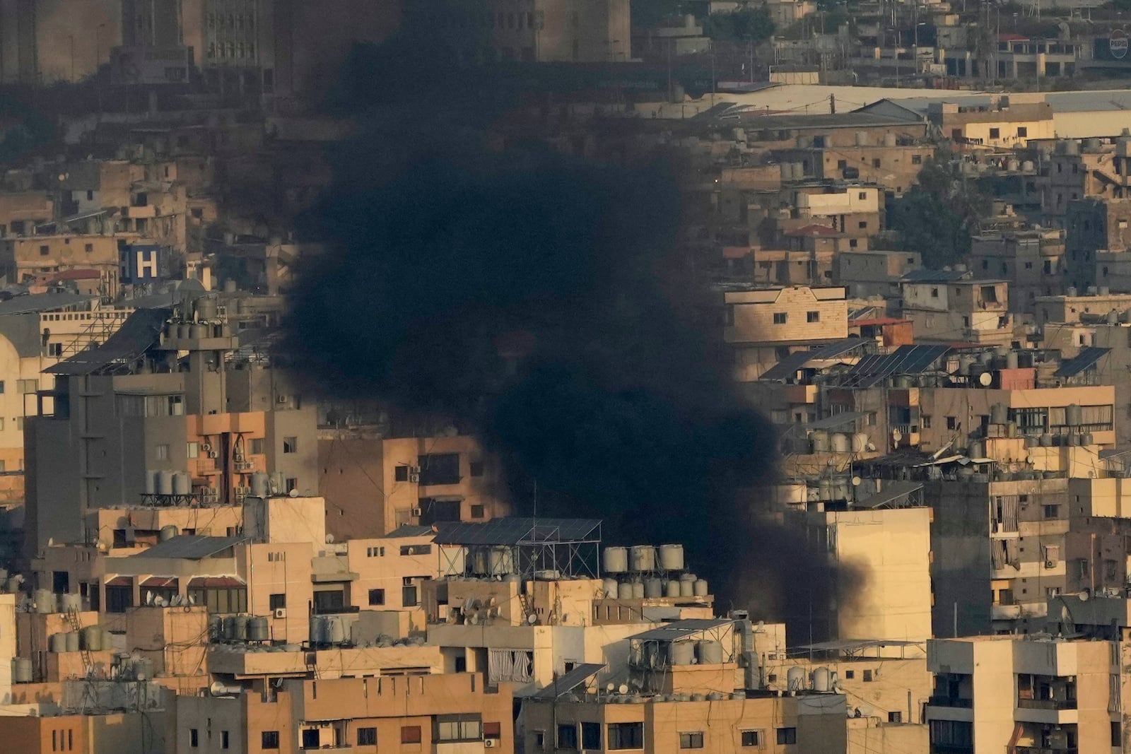 Smoke rise from Israeli airstrikes on Dahiyeh, Beirut's southern suburbs, Lebanon, Wednesday, Oct. 16, 2024. (AP Photo/Hussein Malla)