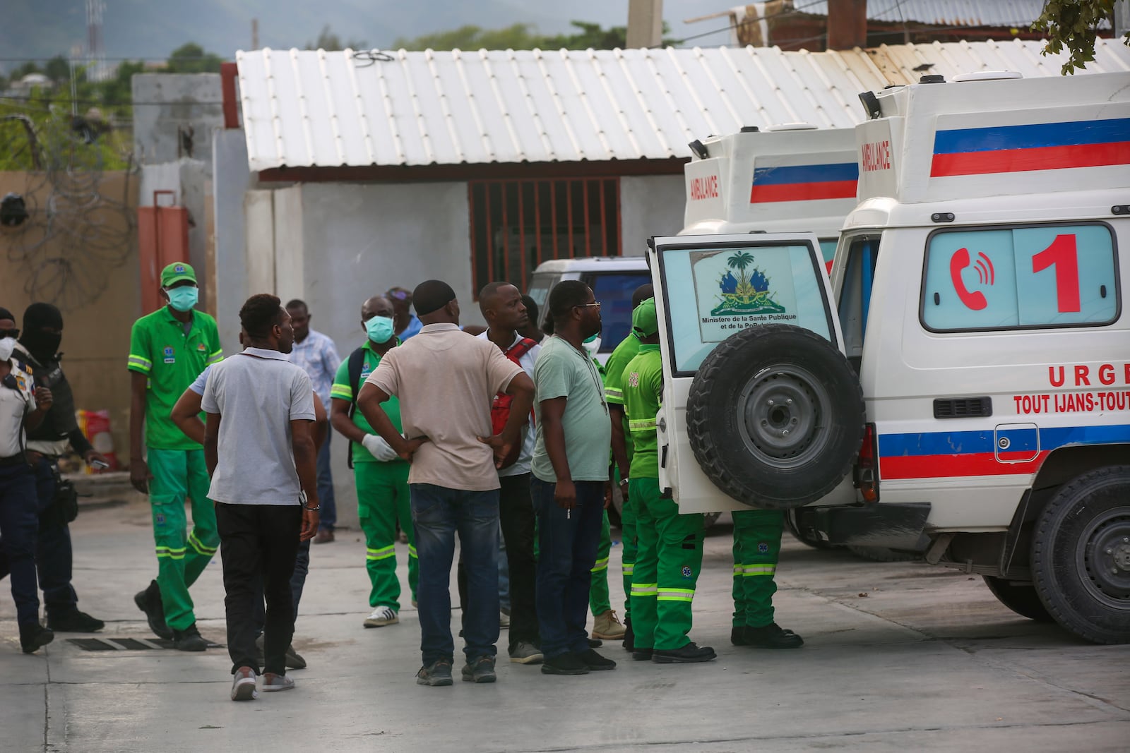 Medics inspect an ambulance of wounded people, shot by armed gangs at the General Hospital, in Port-au-Prince, Haiti, Tuesday, Dec. 24, 2024. (AP Photo/Odelyn Joseph)