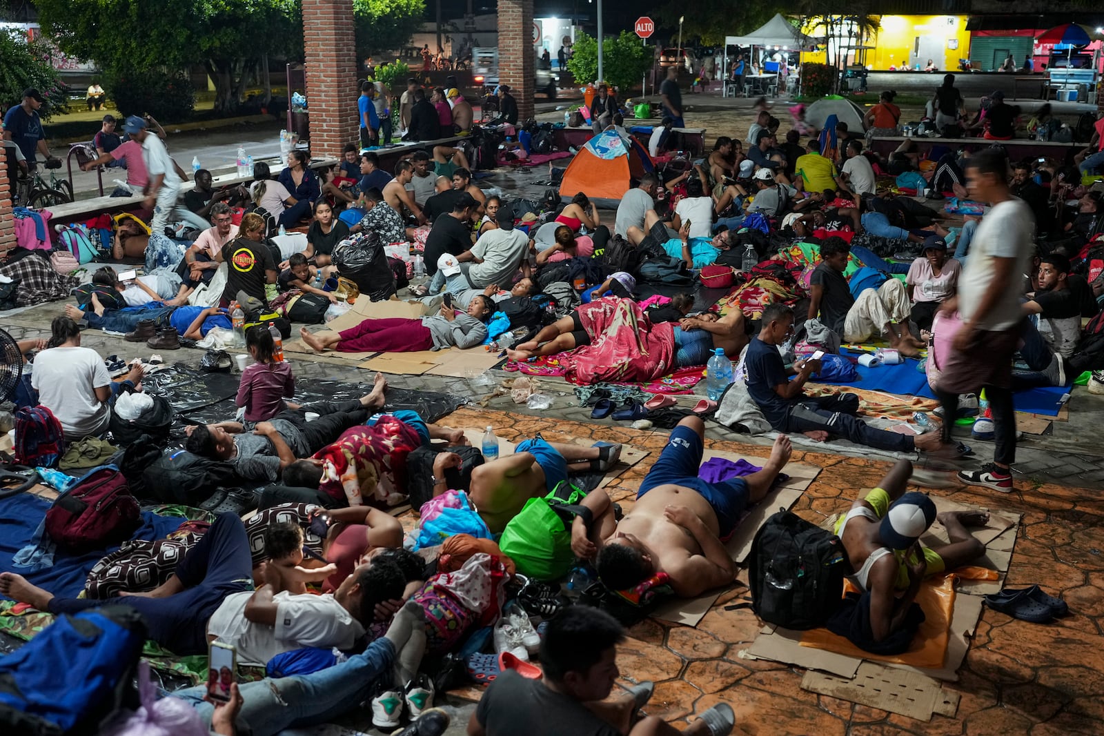 Migrants camp after a day's walk from Tapachula, Mexico, hoping to reach the country's northern border and ultimately the United States, on Tuesday, Nov. 5, 2024 (AP Photo/Moises Castillo)